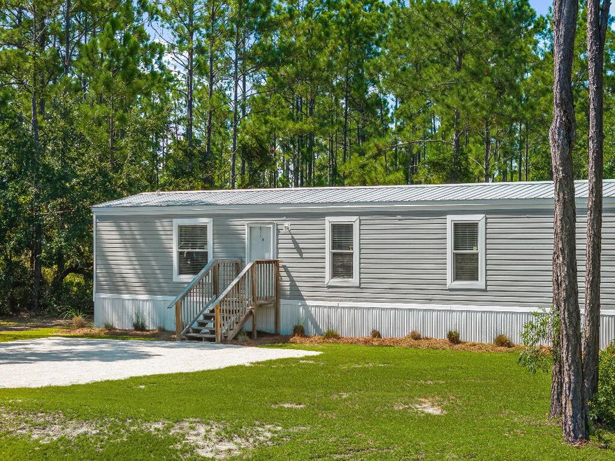 Your Coastal Getaway Awaits! Located in the heart of Santa Rosa Beach, this 3 bedroom, 2 bath home offers the perfect blend of privacy and convenience. Just minutes from the best of 30A and South Walton, you'll enjoy easy access to both the beach and the bay. Sitting on a spacious .55-acre lot with no HOA, this 1,140 sq ft 2019-built mobile home has everything you need--whether you're looking for a personal retreat or a rental opportunity. Inside, you'll find an open concept living room and kitchen, split floor plan, and a built-in entertainment center. The kitchen features stainless steel appliances, a farm sink, breakfast bar, and recessed lighting. The oversized main shower adds a touch of luxury to your daily routine. Outside, enjoy a fenced area behind the home, plenty of room for vehicles, boats, or water toys, and the convenience of public road access, water, and sewer. No HOA. Just freedom and coastal living at its best. Schedule your showing today!