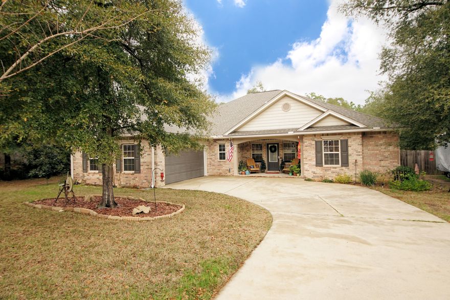 This beautifully custom designed 4/3 home is perfectly situated in a quiet cul-de-sac in the serene neighborhood of Camellia Cove! Enter to a charming open floor plan with arched entryways, built in bookcases, hardwood floors and upgrades throughout. The bedrooms are spacious with 2 bedrooms sharing a Jack and Jill bathroom that is accessible to the main living area as well. A chef's kitchen! With appreciable prep space, plenty of cabinets, granite counter tops and stainless appliances. Your master bedroom is a spacious one with a double door entry and a grand master bath complete with dual sinks, walk in closets, a soaking tub and a separate stone shower. This home sits on over a half of an acre with tress and tranquil backyard.