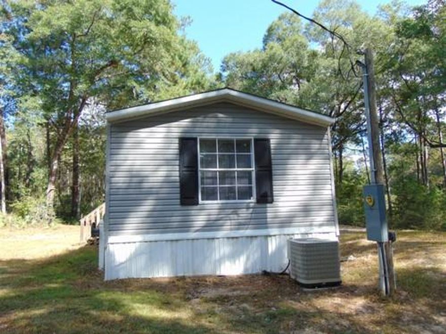 Location on this mobile home is very convenient to the city limits of DeFuniak Springs or a short 30 minute drive to the Beaches of South Walton. The mobile home is located on 1 + acres and was built in 2009. It has recently been painted through-out with new carpet and laminate flooring. Seller will finance with 10% down! All measurements must be verified by buyer.