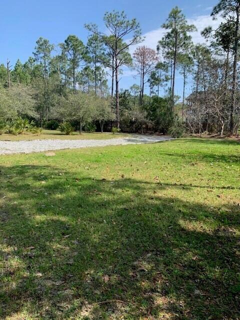 Accepting Back Up Offers for this Ideal Homesite for a Custom Luxury Estate.Build a dream home on this exceptional homesite, perfectly suited for a spacious luxury residence. Located minutes from the world-renowned white-sand beaches off Scenic Highway 30A and close to the serene Choctawhatchee Bay, this prime location offers the best of coastal living. Enjoy easy access to all manner of watersports--boating, paddleboarding, kayaking, and fishing are just moments away.All utilities--including water, electric, and sewer--are already on the property, saving you time and expense during the building process.Zoned Conservation Residential (CR-2.5)--allowing one unit per 2.5 acres--this property offers privacy, natural beauty, and strong long-term value in one of the most desirable area