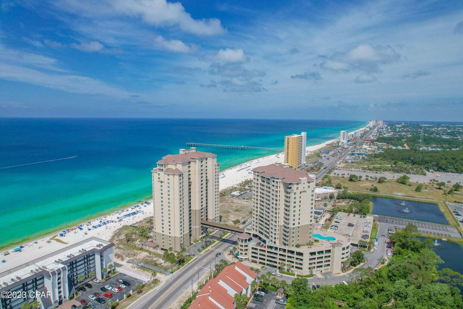 Stunning views down the coastline in both directions and from every room! There is an advantage to being just across the street from the beach.-not only do you have the beach view but at night you also have the coastal lights! This spacious and cheerful 3 bedroom, 3 bath condo has lots of large windows flooding light and magnificent views from every room! All the windows are dressed in beautiful roller shades, the unit is fully furnished, the master closet is huge and completely customized, sliders give access to the balcony from the master suite and the living area, and a separate storage room is just outside the unit. The 11th floor is perfect-not too low for noise and not too high for the weak kneed. Grand Panama is at the heart of Panama City Beach,