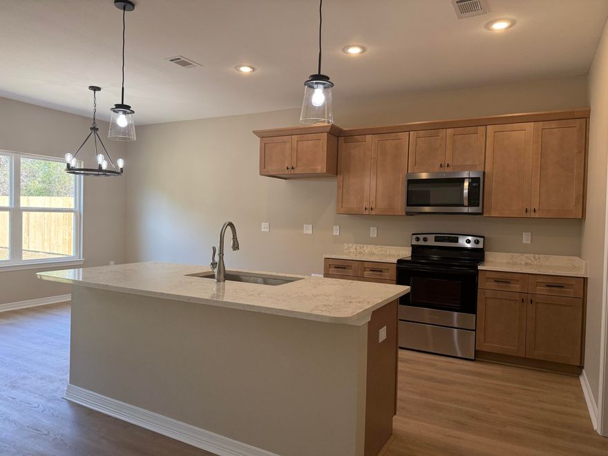 Move right into this newly completed construction home--blinds already installed and ready for its first owner. Builder is offering up to $10,000 toward Buyer's closing costs, prepaid items, or interest rate buydown with use of the preferred lender. Positioned on a generous .36 acre lot , 3-bedroom, 2-bath residence features a classic full brick exterior and a smart, open-concept layout designed for everyday living. The kitchen offers a large center island, quartz countertops, and a seamless flow into the dining and living areas--perfect for gathering and entertaining. Durable LVP flooring runs throughout the home. The spacious primary suite includes a dual vanity and walk-in closet, while the split-bedroom design provides privacy for guests. Complete with a 2-car garage, & laundry room. Included features; Window Binds in every room and a 6' privacy fence. Added Bonus $10,000 toward buyer closing fees!! 