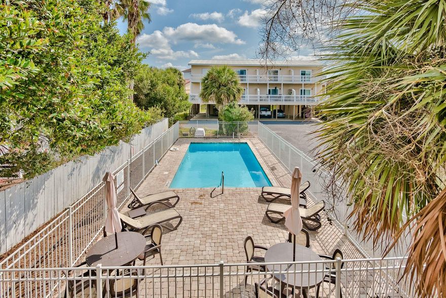Great location South of 30A in Blue Mountain Beach.  This 2BR/2BA townhouse is just a short walk (300 ft.) to the public beach access with facilities.  The small community of Sandcastles by the Sea has a community pool and close to restaurants and shopping in the heart of Blue Mountain Beach. Open floorpan with Living, Dining and Kitchen with breakfast bar. Other features are the multiple decks for entertaining and a 12x12 storage room for beach equipment, bikes, ect. on first floor.  2 covered parking spaces under the building and additional parking in front of the building. Don't miss this rare opportunity south of 30A.
