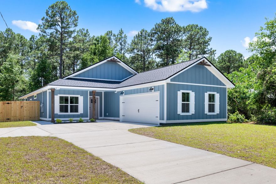 NO HOA, 5 minutes to Navarre Beach! This semi-custom home offers 1965 square feet of spacious living with 4 bedrooms, 2.5 bathrooms, and an expansive oversized backyard! The home's standout features include custom cypress wood beams and vaulted ceilings, adding warmth and character to the already beautiful design. The walk in pantry, gas range, and side-entry garage make for a modern and comfortable living experience that you'll enjoy every day. Don't forget your gas fireplace to cozy up to on those chilly overcast days! The master bathroom boasts a luxurious free-standing tub and beautifully tiled shower, offering a spa-like experience at home. You'll never have to worry about running out of hot water with the tankless water heater - a feature that will surely impress. This is not your average builder-grade house - it's a true gem with curated designer fixtures and finishes. With a focus on personalized service and attention to detail, you can trust that your home-buying experience will be second to none. Contact us today to learn more about how you can make this house your forever home! Estimated completion Nov 2025