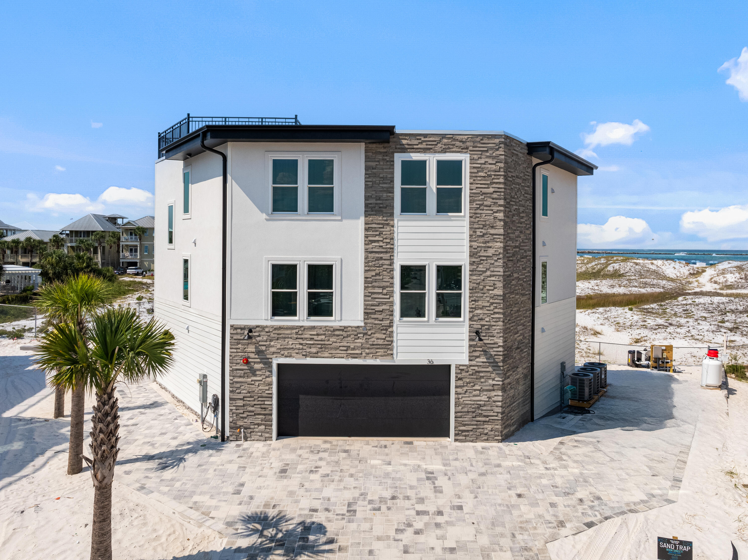 Spectacular New Construction with Unrivaled Views! This fully furnished, rental-ready masterpiece offers 6 bedrooms, 6 full baths, and 2 half baths across 3,000+ square feet of impeccably designed living space. Perched on Holiday Isle, the home boasts panoramic, unobstructed views of the Destin Pass and Gulf that are truly second to none. Every detail has been crafted for comfort and style -- from designer furnishings to premium finishes -- creating the perfect blend of coastal elegance and modern luxury. Whether you're looking for a private retreat or a high-performing vacation rental, this home delivers.Added Bonus: Enjoy your own private rooftop retreat, complete with lounge chairs -- perfect for soaking up the sun or unwinding with unforgettable views.