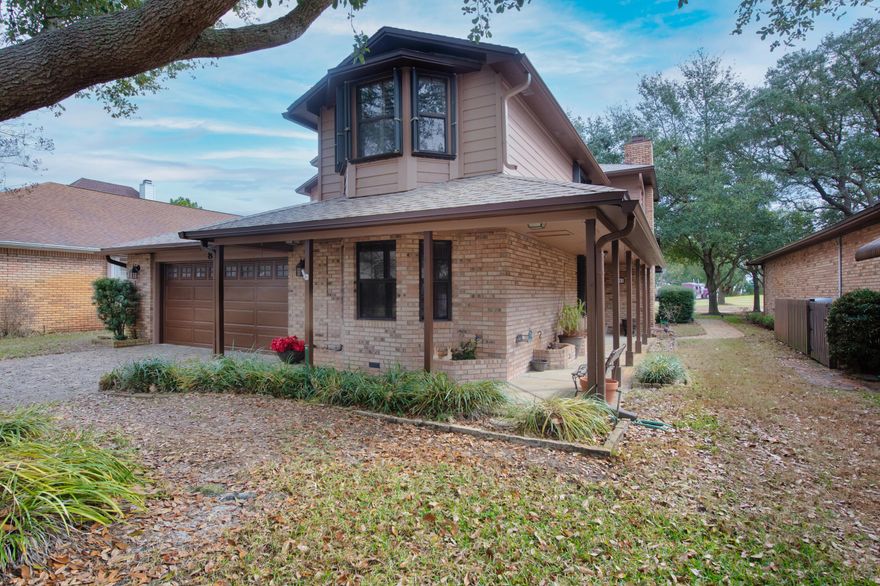 Enjoy views of the 9th fairway of Shalimar Pointe Golf Course from this well maintained custom home. No expense was spared to outfit the kitchen with hand-crafted hickory cabinets featuring organizational pull outs. The large kitchen island is finished with large drawers for pots and pans. You'll love the attention to detail throughout the home. Crown molding, plantation shutters, a gas fireplace surrounded by built-in cabinetry, and a large Florida room are just a few of the custom features. The first floor bedroom with a remodeled en suite can serve as a second primary. The large upstairs primary bedroom has plenty of room for a king-sized bed and furniture set, features an updated en suite, balcony and a true walk-in closet.The oversized garage features a separate golf cart room-
