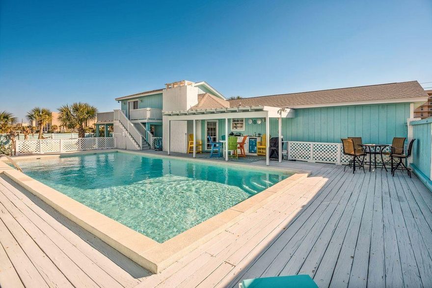 Few locations will allow you to fully enjoy all of the outdoor recreational activities Northwest Florida's Emerald Coast has to offer better than this remodeled home on Okaloosa Island. Situated across the street from the Gulf of Mexico and two blocks south of the Santa Rosa Sound, only 300 yards separates it from the nearest beach access. Gulf views can be enjoyed from its large wrap-around balcony that also overlooks its spacious, fenced back yard with a private in-ground pool.
The entry gives way to an open concept floor plan with a recently updated kitchen that overlooks the living area. Situated on a corner lot that is just over a one-quarter of an acre offers plenty of space to park and secure a boat which can be launched from the public ramp at Marler Park just two miles away.