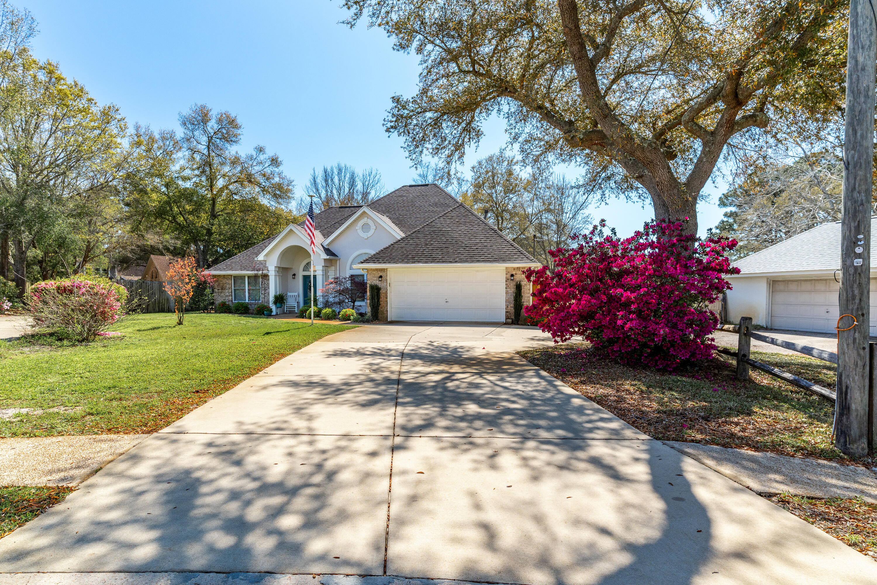 SUNSETS coffee and cocktails. This is an exceptionally well maintained LAKEFRONT home in a mini cul-de-sac location. On entering the home the wide foyer offers a dining room to the right. Be sure to look at the amazing architecture of the ceiling! This attention to detail is found throughout the house. Two bedrooms are on the left, one presently being used as an office. the master is along the hallway with access to the patio. Beyond the eye catching 3 sided fireplace is the delightful breakfast nook with bay window. The well appointed kitchen offers gleaming stainless appliances, a five burner gas stove, pantry and granite countertops. Your plants will love the Florida room, you will too! The backyard patio has a pergola with lights for your enjoyment, then venture down to the dock- Take a book or fishing pole, or paddle around the lake in your kayak. The only upstairs bedroom is huge, even offering room for a sitting area overlooking the lake - school room, teenagers retreat, craft room, guest quarters with private bath. This is a most impressive home that takes your breath away. Come and visit today - you will not be disappointed.