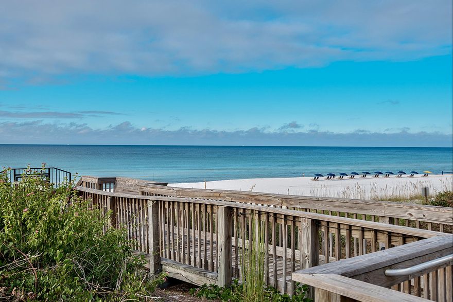 Experience unparalleled vistas and exceptional privacy from this 3 bedroom enclave located in the gated community of Avalon Dunes. Fresh paint, new carpet and finely appointed custom finishes characterize this gulf front oasis. Located on the first level, three floors above ground level, this unit features endless water views perfectly framed by arched accents presiding over the white sand beaches of the Gulf of Mexico. A notable feature includes a private walking path from the covered balcony directly to the beach and community pool area. It's Western location in the building provides unobstructed views and ample privacy. The floor plan is extremely open and spacious with travertine flooring, new paint and new carpet in the bedrooms.
