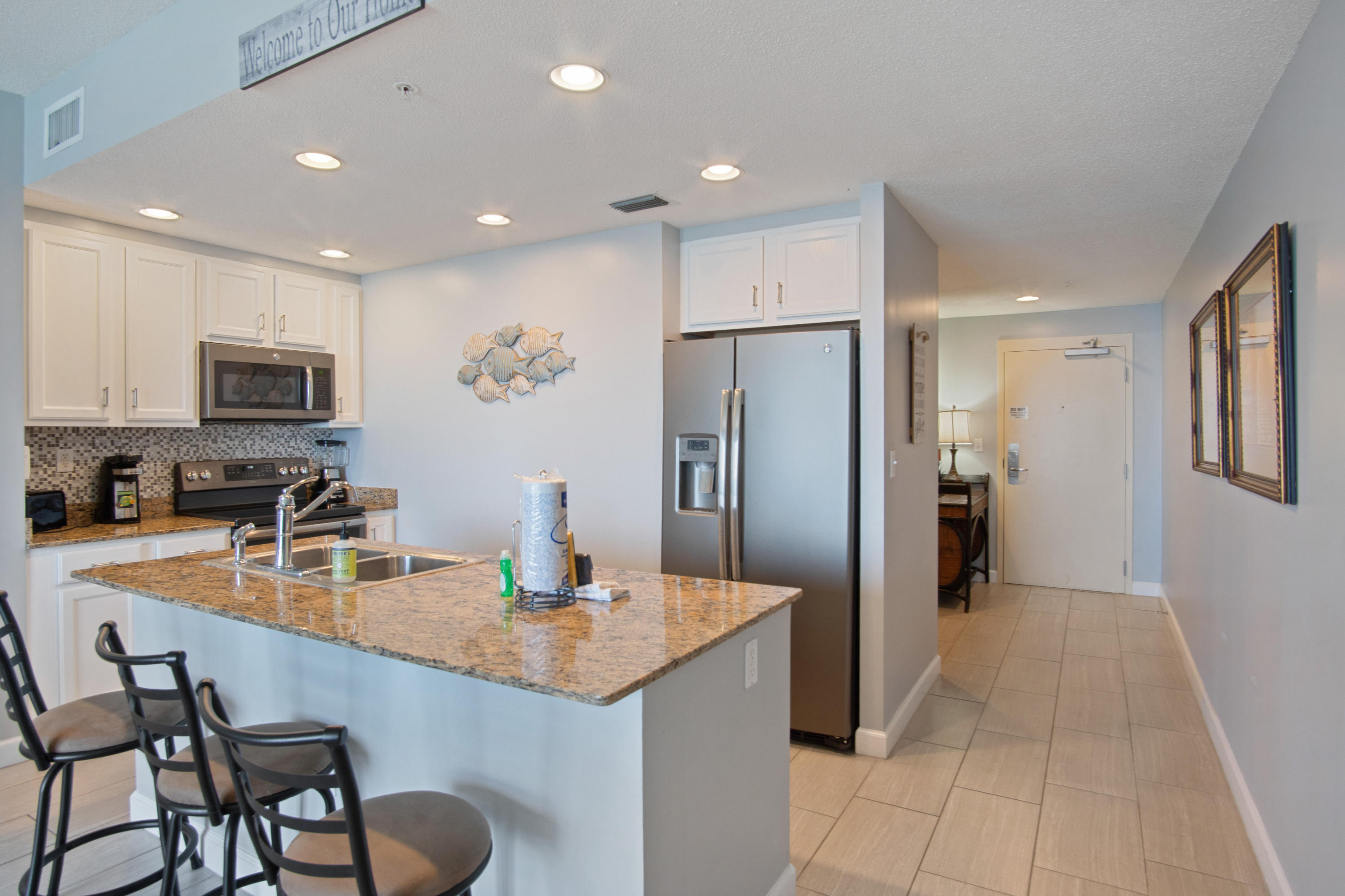 The Spotlight has stopped here! This property is sold FULLY FURNISHED, has a new HVAC and has everything you and your guests desire. Your private balcony allows you to view The Emerald Coast's green waters and the endless beach. The updated kitchen features Stainless steel appliances, a beautiful back-splash, granite counter tops and amazing shaker cabinets. Gorgeous flooring is shown throughout the deluxe sized condo. Check out the remodeled bathrooms and the amazing details added into them.The master bedroom is gulf front w/ a private entrance to the balcony. Your family and your guests will take advantage of the gorgeous heated swimming pool, sundeck, fitness center, and activity room, as well as easy beach access. A remodeled unit priced like this DOES NOT come along very often.