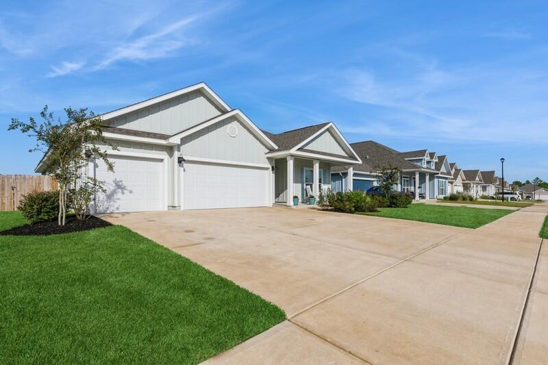 Welcome to this stunning Craftsman-style home located in the stylish new construction area of Shoal River Landing! This beautiful four-bedroom, three-full-bathroom home, only two years old, is a unique Destin plan with modifications that enhance the floor plan, including an added flex room currently being used as a playroom - a feature you won't find in any other Destin plan. This home boasts a spacious three-car garage and a covered patio measuring 12.5' x 15', perfect for outdoor relaxation. Inside, you'll find wood grain LVP flooring, trey ceilings, granite countertops in the kitchen and bathrooms, stainless steel appliances, a kitchen island with cabinets, and a corner pantry.

Each bedroom offers walk-in closets, with the master bedroom featuring trey ceilings and a luxurious master bathroom with a double vanity, a walk-in closet, a garden tub, and a large separate shower.

The current owner has installed custom shelves throughout the garage, which will convey with the home. This purchase includes a smart home connect system, a video camera doorbell, and keyless entry. All utilities are underground, and the community offers a pool, a pavilion, and sidewalks for your enjoyment.

Additionally, the current owner has added solar panels to combat rising FPL electric bills. The solar panel loan can be assumed, as can the mortgage with an attractive interest rate of 2.9%.

Don't miss out on this incredible opportunity to own a truly unique and modern home in Shoal River Landing!