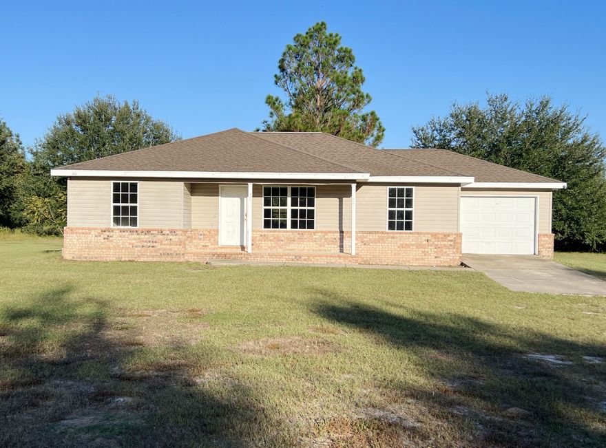 REO. Opportunity Knocks! Your 1-Acre Dream Awaits in This 2006 Split-Plan Home! Don't miss the chance to customize this spacious 3-bedroom, 2-bathroom gem, perfectly positioned on a level 1-acre lot. Built in 2006, the home features a desirable split-bedroom floor plan, modest size 3 bedrooms with 2 baths. Home has vaulted ceilings that enhance the main living areas, dining area and galley kitchen. This gem has some brick, vinyl siding and a convenient 1-car attached garage. Home does need repairs and may not qualify for most financing. Call today!