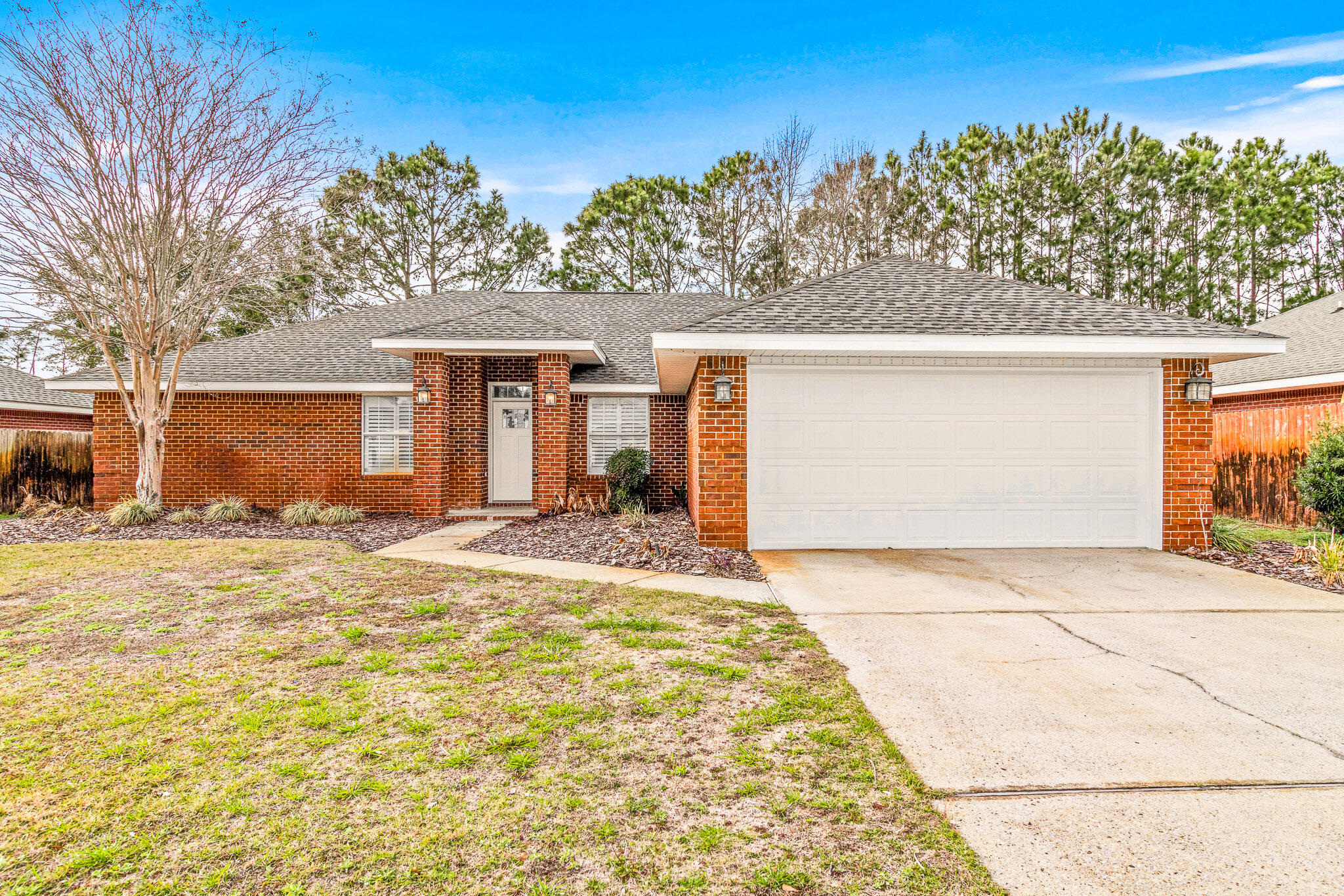 Welcome to this stunning 3-bedroom, 2-bathroom home located in desirable Santa Rosa Beach. This beautifully designed house offers a range of modern amenities to enhance your living experience. Step into the spacious kitchen, complete with stainless steel appliances, a dishwasher, and a convenient pantry for all your storage needs. The washer/dryer hook-ups make laundry a breeze, while the new carpet and fresh paint throughout create a welcoming atmosphere. The new light fixtures illuminate the space, highlighting the luxurious vinyl plank flooring and custom kitchen with quartz countertops. The double vanity in the bathroom adds a touch of elegance, while the walk-in closets provide ample storage space.