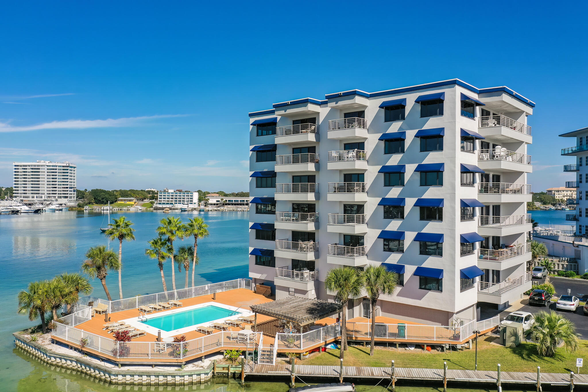 Completely renovated penthouse with a boat slip AND deeded beach access! Holiday Isle is one of the only places in Destin where you get the best of both worlds... boating and beach! Located directly on the Destin Harbor with some of the best views in Destin, units in this building rarely come on the market. The interior of this unit has been remodeled with nothing un-touched. Features include: BUILT-IN appliances - Subzero fridge/freezer with interior water dispenser, Cove dishwasher, U-Line beverage/wine fridge, U-Line ice maker (shaved ice, nugget ice, etc). Bertazzoni induction range, Zephyr downdraft that ascends from countertop. Custom Grimes Cabinetry throughout... coffee bar, dining built-ins, kitchen, laundry. Antique Chicago brick accent. Custom lighting throughout, all on