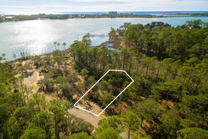This is your opportunity to own one of only a few Water view lots in the exclusive, gated community of Wild Heron. This water view lot offers the ultimate in privacy with all the fun offered by Wild Heron and Lake Powell at your finger tips. Kayak to the Gulf, fish the pristine waters, enjoy the lake side pool or stay fit in the lake front gym. It is all yours, all the time with everything 30A and PCB just minutes away!