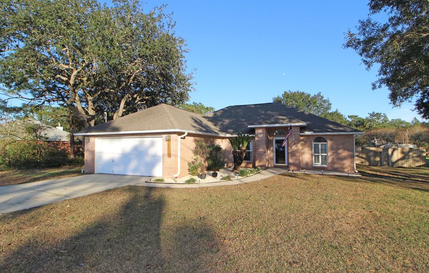 FANTASTIC CUSTOM BUILT HOME SITUATED ON A LARGE LOT IN DESIRABLE HOLLEY BY THE SEA! Open to a spacious living area with cathedral ceilings, designer paint color, corner fireplace with custom mantle, recessed accent lights and new laminate flooring throughout. Dining area has new light fixture and a large picture window with arched accent. Light and bright kitchen with lots of counter space, pantry, breakfast bar and tile flooring. Breakfast nook that overlooks the backyard. Master bedroom with trey ceiling. Master bath with raised new granite counter, double vanities, separate shower, garden tub and a large walk-in closet. Split bedroom floor plan allows privacy from kids or guests. Two additional bedrooms and a hall bath complete this perfect picture. Backyard is fully fenced and an open