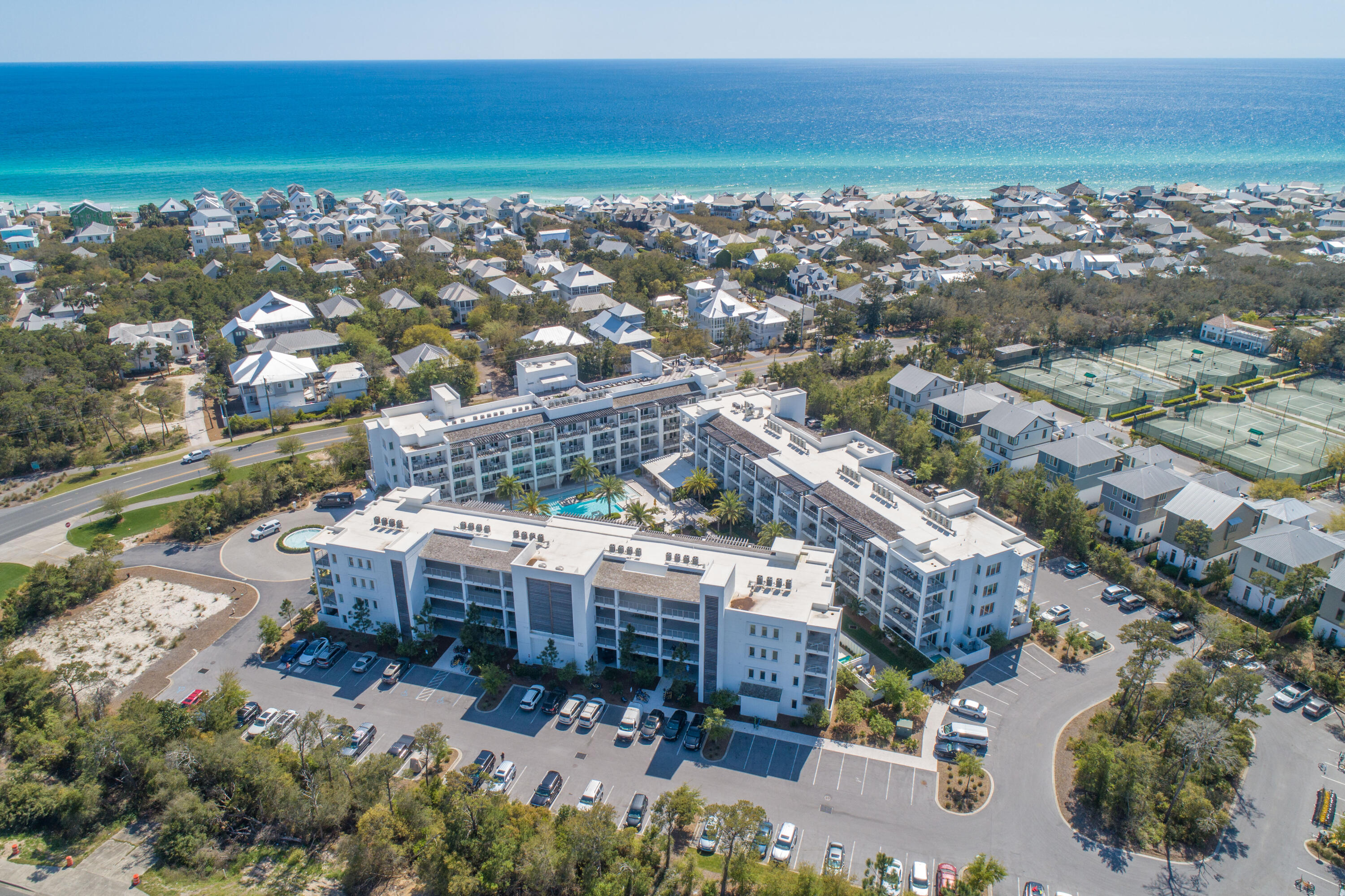 *Model Virtual Tour Available*This two-bedroom two-bathroom condo offers gorgeous views of the palm trees and cabanas around the Caribbean-style pool at this luxurious architectural award-winning resort on the east end of 30A. Directly next to Rosemary Beach, at the intersection of Hwy 98 and Hwy 30A, just across the street from the shops and dining of 30 Avenue, this is a coveted piece of real estate on 30A.