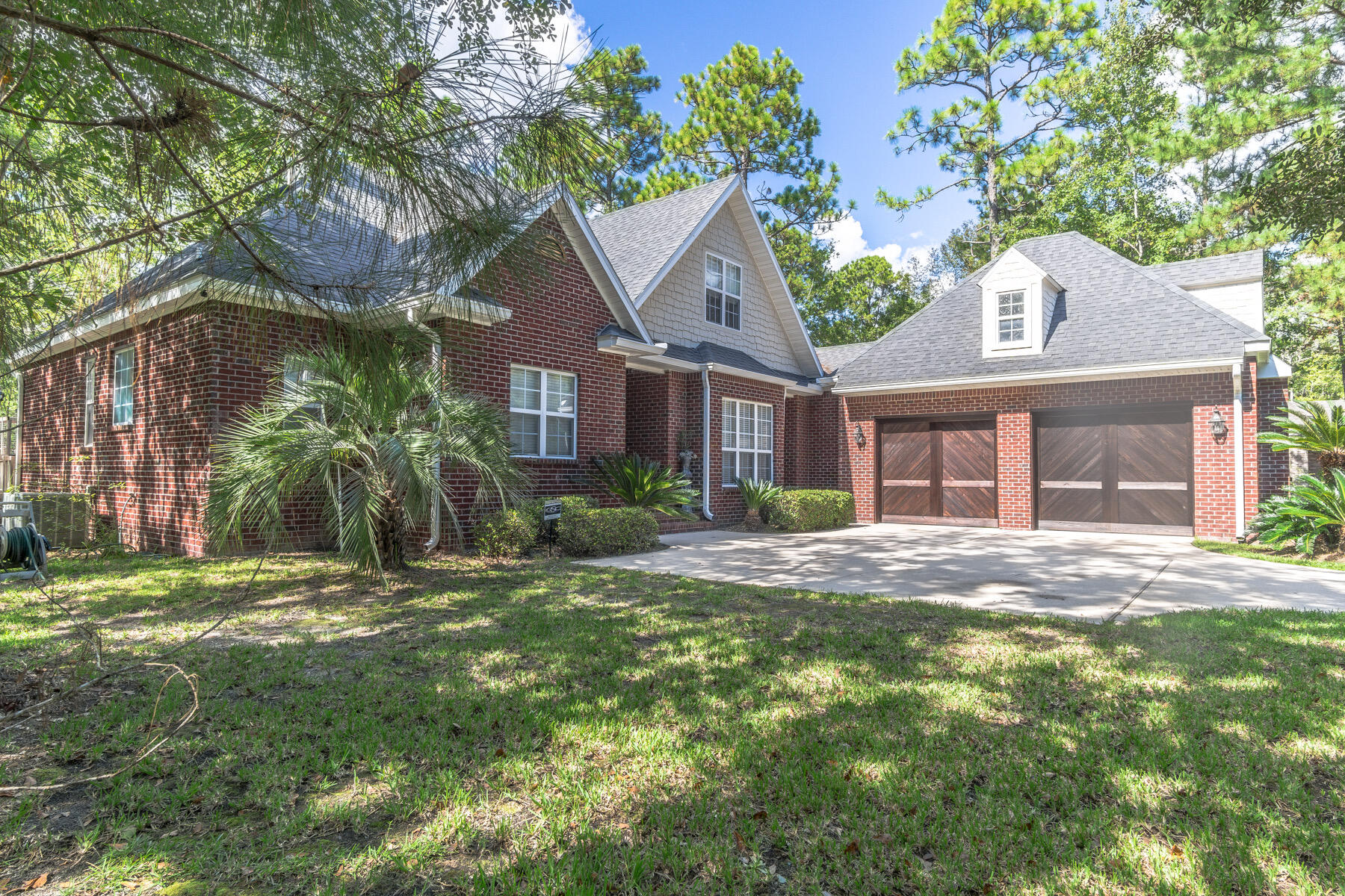 Welcome home! This very well maintained home is situated in the quiet and convenient neighborhood of Bay Harbour. Just off of State Highway 20, enjoy the easy commute to all military bases and the white sandy beaches of the Emerald Coast. This home features 4 bedrooms and 3.5 bathrooms. As you walk into foyer, you're greeted by beautiful engineered hardwood floors and an open concept. The kitchen features large shaker cabinets, stainless appliances and granite countertops. The master is conveniently located on the first floor with a fireplace, large closet, double vanity, large garden tub and separate shower. There is also a second bedroom and full bathroom on the first floor, as well as a half bathroom, perfect for guest use.