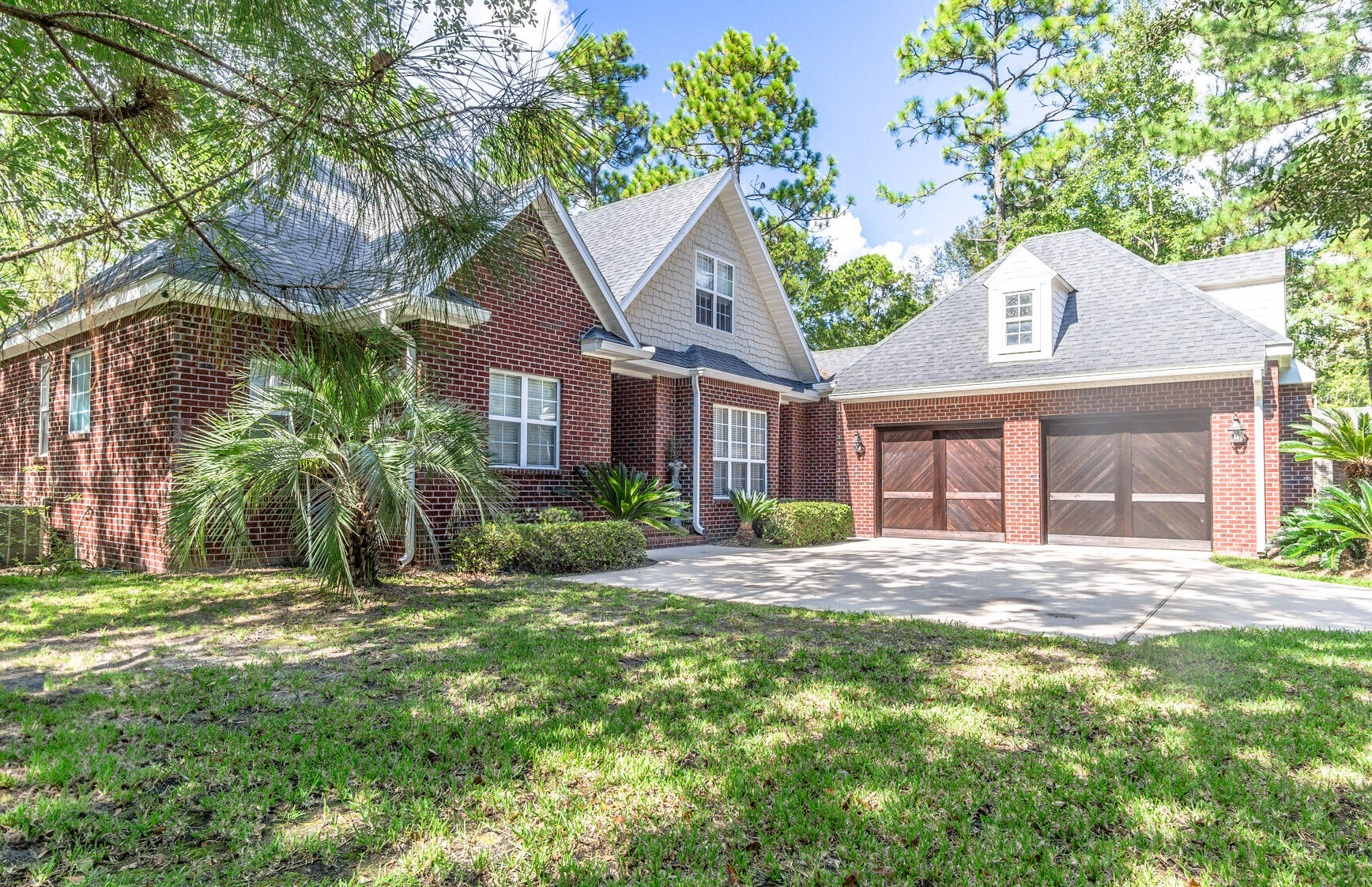 Welcome home! This very well maintained home is situated in the quiet and convenient neighborhood of Bay Harbour. Just off of State Highway 20, enjoy the easy commute to all military bases and the white sandy beaches of the Emerald Coast. This home features 4 bedrooms and 3.5 bathrooms. As you walk into foyer, you're greeted by beautiful engineered hardwood floors and an open concept. The kitchen features large shaker cabinets, stainless appliances and granite countertops. The master is conveniently located on the first floor with a fireplace, large closet, double vanity, large garden tub and separate shower. There are also 2 more bedrooms and a full bathroom on the first floor. Also located on the first floor is a half bathroom, perfect for guest use. The second floor features 2 more spacious bedrooms and a full bathroom. The laundry room is located on the first floor and leads out to a true 2-car garage. Step outside the back french glass doors and you'll be greeted by an expansive deck perfect for sipping your morning coffee. Enjoy listening to the wildlife and gazing at the wooded area behind the home; an area that won't ever be developed. Come see this gem today and call it your new home!