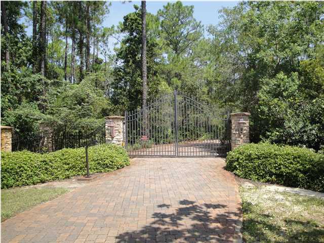 We invite you to this magnificent 18 acre Bay Front Gated Estate which is one of the most exclusive waterfront estates on the Emerald Coast. Live in grandeur in this custom home situated on over 800 feet of bay frontage on the Intra Coastal Waterway known as the Choctawhatchee Bay designed to capture the breathtaking views. This stately home is offered fully furnished except for some antiques. Enjoy it as a single family compound, or should you wish, develop a prestigious gated neighborhood of large home sites. You will arrive through stately wrought iron gates and the brick paved entry drive meanders for several hundred yards offering total privacy amidst a backdrop of lush landscape. vegetation and trees. The ''Monet-like'' picturesque fishing pond features an island, a bridge,