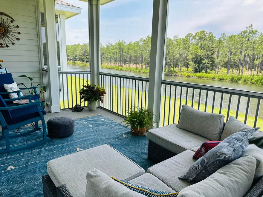 Beautiful lakefront townhome with exceptional views inside and out. Less than 3 miles from the beach and the bay. Designed with comfort and sophistication in mind, the interior features high ceilings, and an open, light-filled layout. The gourmet kitchen is a chef's delight, boasting custom soft-close cabinetry, quartz countertops, stainless steel appliances, a gas cooktop, and an oversized island ideal for entertaining.