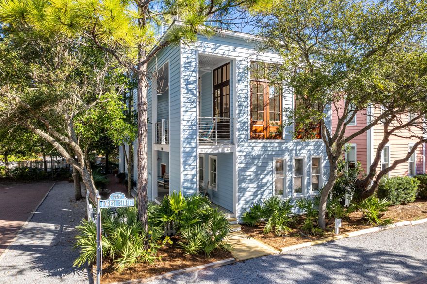 Take a Charleston-inspired home, build it in one of the most prestigious, award-winning communities along 30A, position it in a desirable location in the town, and you'll find ''Just for Fun!''  This impressive home is a modern take on the Charleston design with its many generous porches, beautifully landscaped side yard and plenty of privacy.  With a commanding presence on the corner of Odessa and Forest Streets the location accommodates parking on the west and south sides. Because Odessa Street dead-ends next to the house, you have an extra feeling of privacy with no neighbor next door and no traffic on side street. The home is near the west-end family pool and just a quick stroll to the beach, making this a preferred location for families. The first level of the main house offers two king primary bedrooms, both with en-suite baths that ensure privacy for you and your guests.  The second-floor surprises you with a grand living room topped by a soaring ceiling height, providing an incredible sense of spaciousness and plenty of natural light.  Throw open the French doors onto the side porch and expand the living area, blending indoor and outdoor spaces seamlessly.  The kitchen strikes a modern vibe, showcasing new quartz countertops and high-end stainless-steel appliances - Viking gas range, Liebherr refrigerator, Bosch dishwasher, and built-in Sharp microwave. Off the kitchen, a new half bath and laundry area was recently added.  At this level, the main and guest quarters connect for extended family. The third floor offers a third bedroom with en-suite bath and a spacious sleeping loft for  the kiddos.  There is also a large owner's closet on this level.  Another set of stairs leads to a roof top sun deck and then up to a covered tower to enjoy the most spectacular sunsets and gulf views! The entire home has recently undergone a total renovation. The guest quarters can be locked off from the main house and provides a full kitchen, living/dining and full bath on first level and a bedroom with en-suite bath, sleeping loft and spacious porch on the second level. Dining al fresco is made possible by the fabulous patio connecting both cottages.  All you need are your swimsuits and beach towels and you'll be ready to enjoy Just For Fun. 