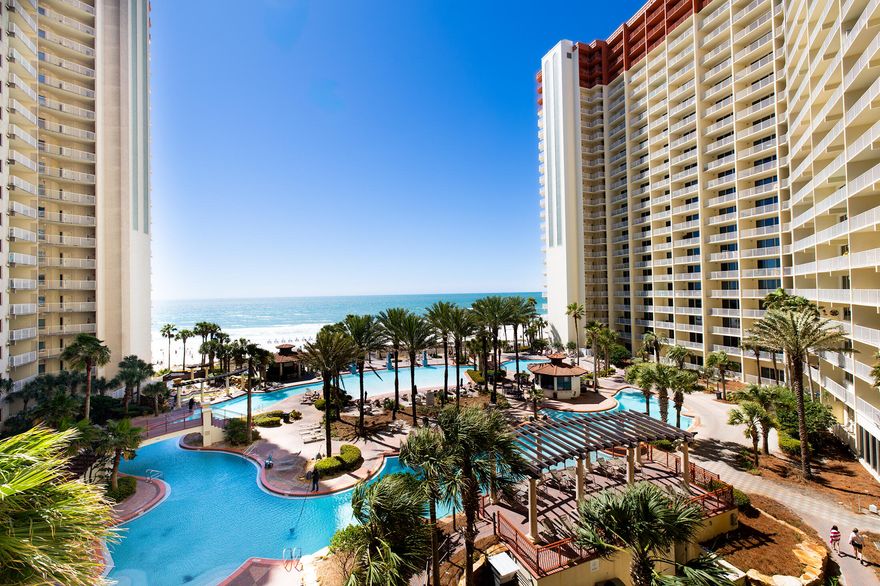 : Looking for a resort property at an unbeatable price? Look no further! Unit 518 offers a direct Gulf view from the living room, kitchen, and primary suite, bringing the beauty of the beach right to your doorstep. The dedicated parking spot is conveniently located directly across from the entrance on the 5th floor of the parking garage. This unit features 2 bedrooms, each with its own private en-suite, and a separate bunk room with a half bathroom, providing plenty of space for family and guests. All stainless steel appliances have been replaced within the last 5 years, the HVAC is just 3 years old, and the water heater is 6 years old. Shores of Panama offers luxurious Gulf-front condos with amenities exclusive to the complex, Click More... ...including 500 feet of Gulf frontage, a 14,000-square-foot zero-entry Gulf-side pool, hot tub, heated indoor pool and hot tub, a fitness center, and two full-service bars serving lunch and dinner. Additional services include beach events, chair rentals, high-speed internet, a coffee shop, and 24/7 security for peace of mind. Located in the heart of Panama City Beach, this condo is next to Pineapple Willy's beachfront restaurant and just minutes from St. Andrews State Park, Pier Park, shopping centers, and endless dining and entertainment options. Not only is this condo a stunning retreat, but the proven rental history is excellent and has even more potential it increase! Schedule your appointment today to see this beautiful property and all it has to offer!