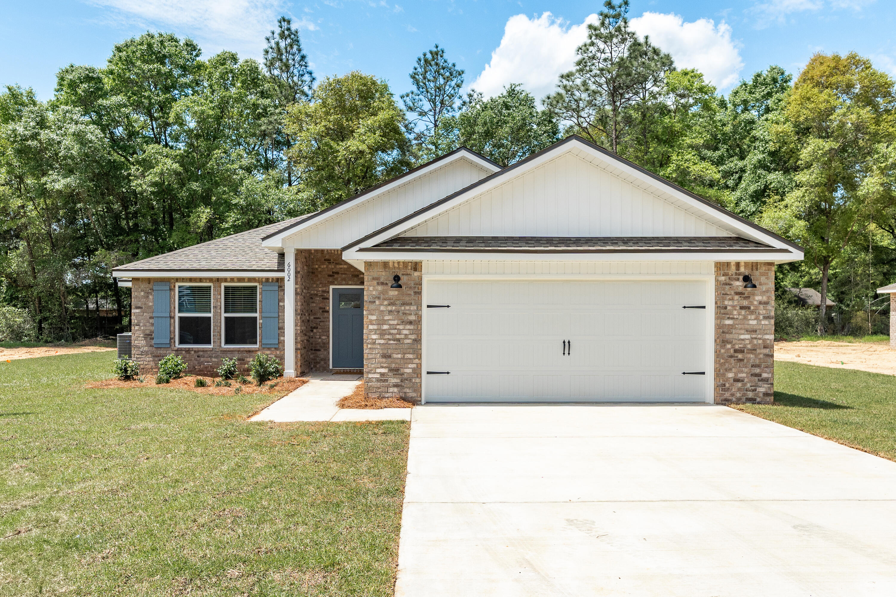 YES-YES-YES to CLOSING COST assistance - $15,000 - REFRIGERATOR & BLINDS! Complete package and move-in ready. The ''Jackson'' plan has a spacious functional flow, featuring open family room/kitchen/dining. The work island has bar seating, cozy dining nook, overlooking covered rear porch. All appliances included, quartz countertops, white shaker style cabinets. Owner's bath has double vanities, linen storage, generous walk-in closet. Split bedroom plan, luxury vinyl plank flooring in common areas, carpet in bedrooms. Finished garage with pull down stairs for attic storage, fully landscaped yard with sprinkler system. NO HOA - call to see today.