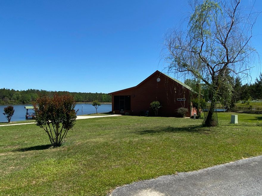 Lake House! Enjoy waterfront peace and tranquility at this gated 16 acre home. Well maintained brick home with barn, boat shed, boat house, and boat dock. Enjoy as primary home or second home retreat. Features include two bedrooms, two baths, spacious open areawith kitchen, dining area, and great room. The stained wood vaulted ceiling in the great room along with the the massive rock fireplace is warm and beautiful.Completely furnished and move in ready. All furniture conveys except, guns, gun case, and personal items.All wild game mounts are negotiable. Enjoy the large relaxing screen porch overlooking the glistening lake.Long asphalt drive with concrete parking area and walkways.Please make your appointment to see today!