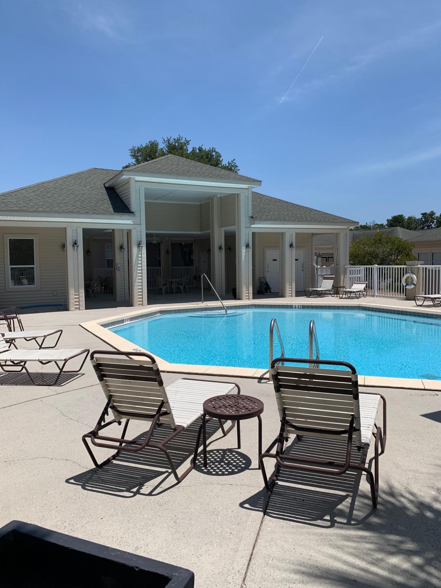 One of the most sought after neighborhoods just off Scenic 30-A. Walk or bicycle to the public beach access. Santa Rosa Golf Club is just across the road. The Courtyards is a 44 home community with a community pool! The courtyard at the front of the home makes a welcoming statement. The living room is large enough to entertain a large party or family gathering. Open concept dining area has French doors leading out to the large, enclosed screened porch with a stone floor. Featuring two bedrooms and two and a half baths on the first floor and the third bedroom/office/studio and bath on the second level.