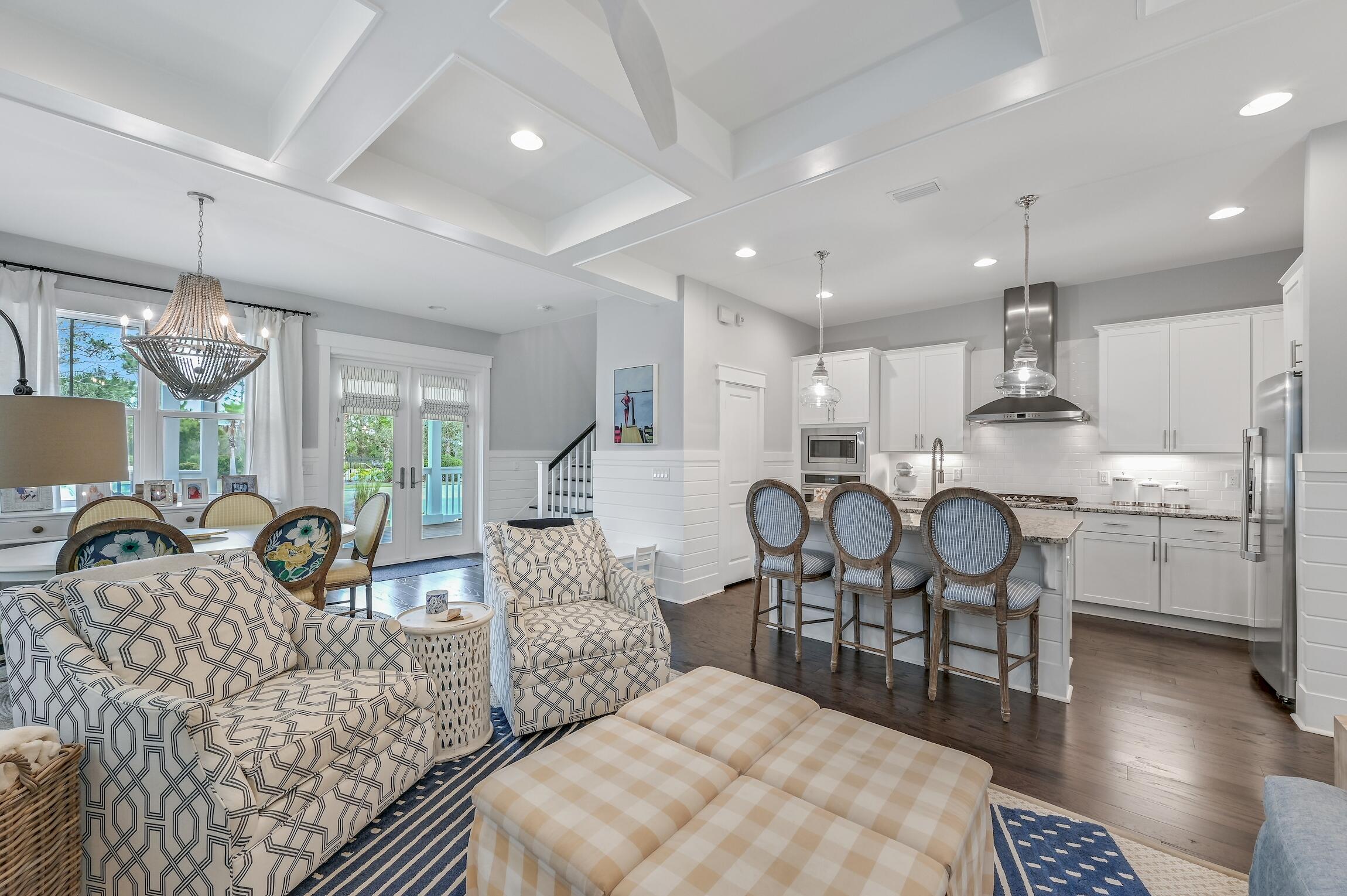 Immersed in nature, this extraordinary home delivers a coastal lifestyle in a prime location at NatureWalk. Spacious, thoughtfully designed and fully furnished, it's just moments from the sugar-white sands at Seagrove Beach. Outdoor living can be enjoyed to the fullest on two generous screened porches that look out onto mature greenery and the surrounding neighborhood. An additional open porch spans the full width of the front entrance providing a traditional southern-style welcome. Brick-paved walkways, golf cart parking and extra-large vehicle parking are complemented by a large storage room for bikes and beach gear. Indoors, this two-story home has bright open living spaces professionally decorated in tones that reflect the nearby beach and sea. Full house Generator and Storage Room!