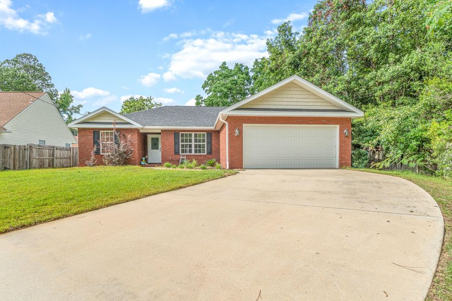 YOUR FUTURE HOME located in South Crestview. This location makes for a very easy commute to the bases and beaches. This stunning 4 bedroom 2 bathroom split floor plan home features tile flooring in the main and wet areas of this home. Nestled on a culs-de-sac with woods on one side and a fenced in back yard.