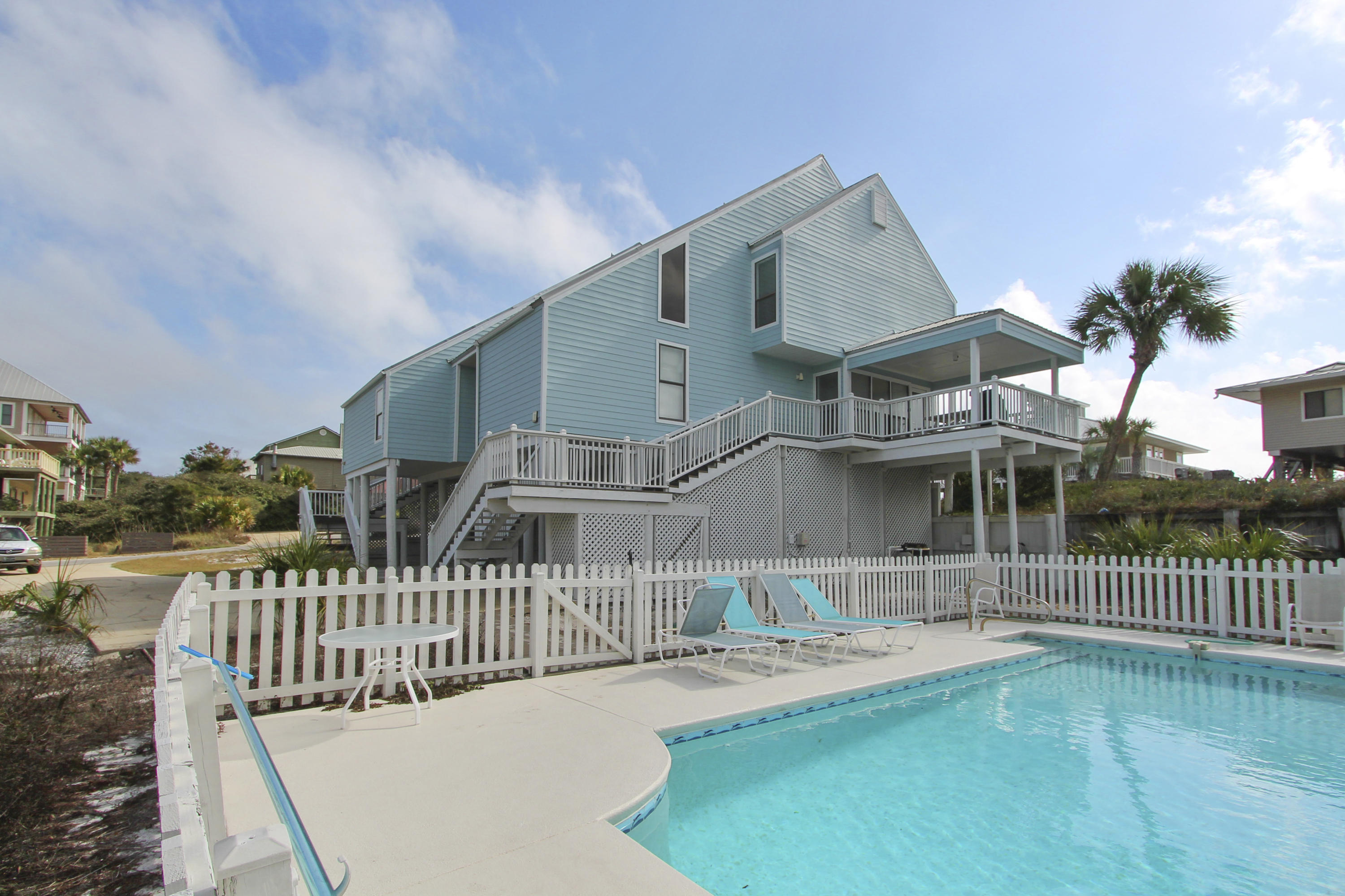 This property is a duplex with the same owner of both units ! Fantastic location one lot removed from the beach and with tremendous ocean views from every room.West side is 4 bdrm/ 2 1/2 bath and the East side is 2 bdrm/ 2 bath. Nice private pool compliments this excellent property. Beach access is apprx. 100 steps away.
