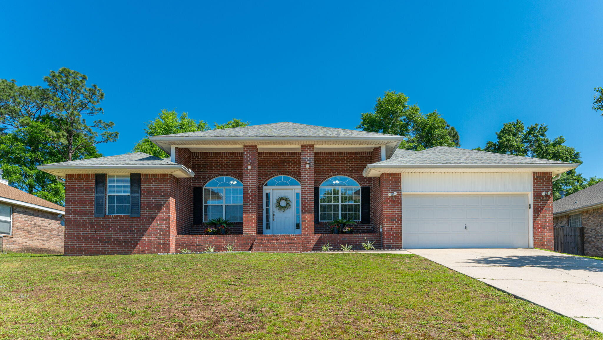 So much value packed into this spacious 5-bedroom home in Silver Oaks! Tucked back on a low-traffic street in one of Crestview's most established neighborhoods. Enjoy new carpet throughout, a cozy gas fireplace in the living room, a formal dining room for entertaining and the kitchen with granite countertops and stainless-steel appliances.Step outside to even more perks: fresh landscaping, a screened-in back porch, detached storage building, and a two-car garage.Located in Silver Oaks, you'll also love the community pool, playground, and sidewalks throughout the entire neighborhood--perfect for evening strolls or bike rides.The big bonus: Seller will install a new roof with a full-price offer, adding immediate value and peace of mind! And don't forget county taxes!