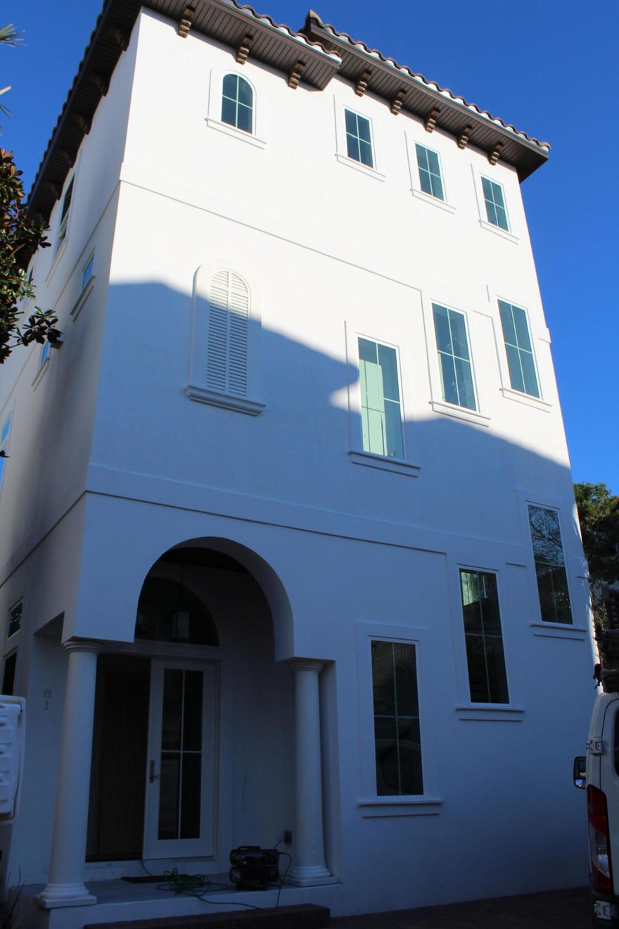 A beautiful contemporary home almost complete! Walk into a grand foyer and take the elevator or stairs to the second or third floors or head to one of two large bedrooms just down the hall on the first floor. Professionally decorated, beautiful hardwoods throughout this home with the kitchen and the first deck -complete with outdoor fireplace - on the second floor. Third floor master has a vaulted ceiling and large bathroom, bunk bedroom and a fifth bedroom. Open the door to the third floor deck and go up the outdoor staircase to the top floor where you will enjoy unobstructed views of the gulf as far as your eye can see!