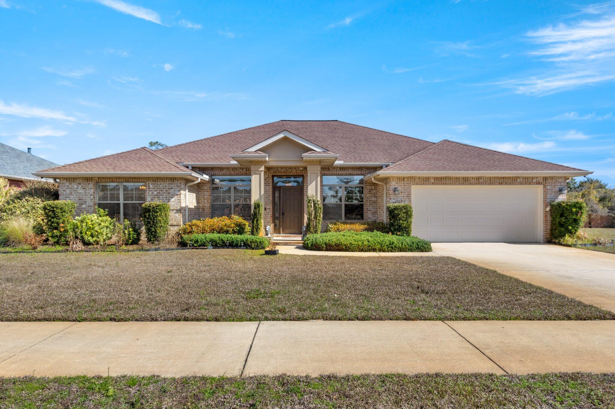 Welcome to your stunning waterview custom built brick home with 4 Bedrooms, 2.5 Bathrooms PLUS a huge Flex room In sought after subdivision of Villa Vizcaya on the Santa Rosa Sound. Neutral colors throughout, crown molding & many custom upgrades! Cathedral ceilings in the great room, kitchen, study & dining room. Rounded corners, ledges, and columns in the main living areas. Stainless Steel Appliances, granite counter tops, Breakfast Bar, Eat-In Kitchen, plus Formal Dining Room. Huge Primary Bath with separate walk-in shower, garden tub, double vanities and a massive walk-in closet. Oversized Primary Bedroom features trey ceiling. Large private and  covered rear porch for your enjoyment. House is completely in high and dry area not in flood zone.