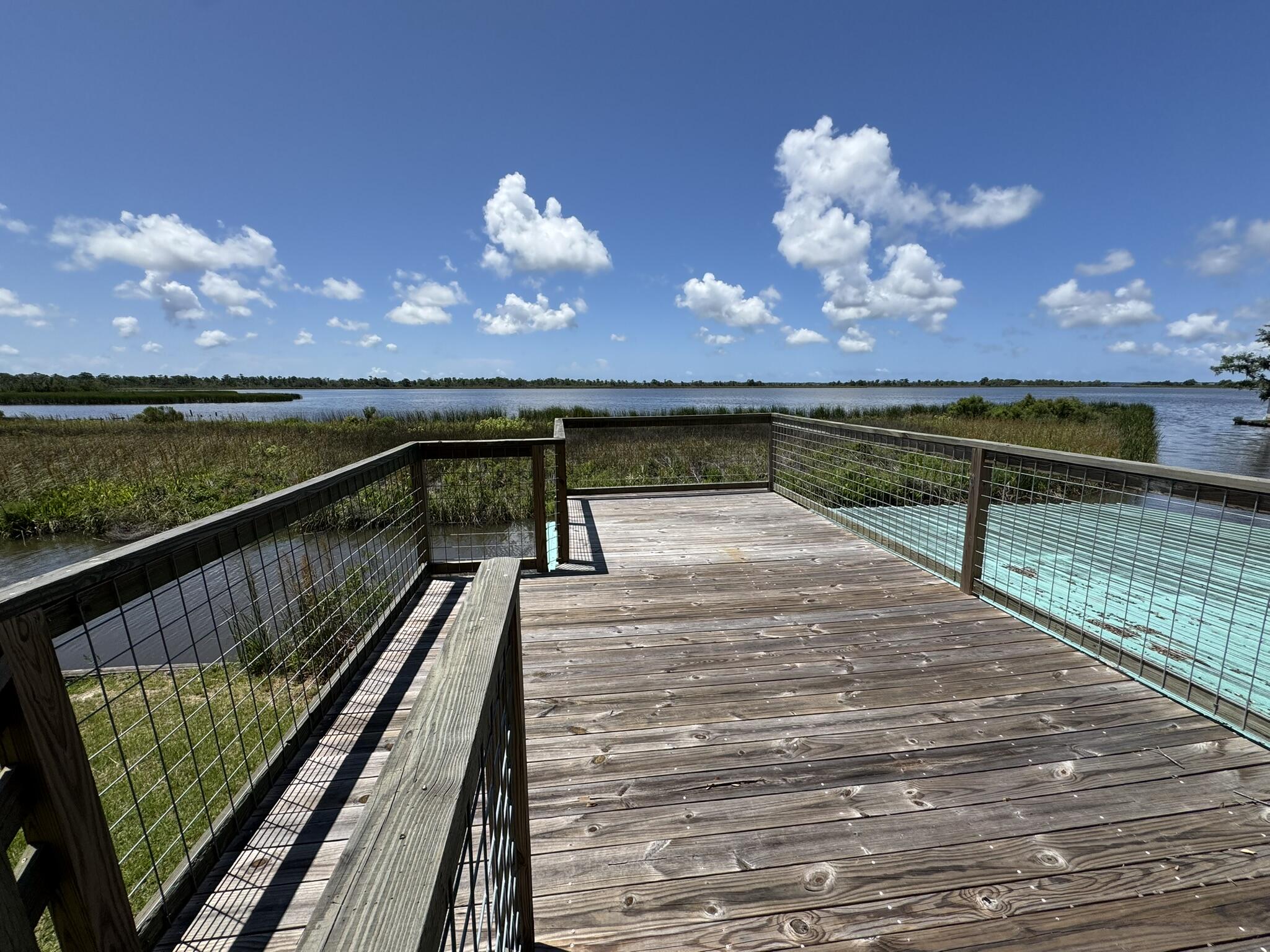Call the owner, Benjie Holley at (334 608 8526 ) for details and showings.Waterfront living at its finest! This 2BR/2BA block home is situated directly on the bay in the desirable Pitts Bayshore neighborhood of Freeport. Enjoy breathtaking water views and easy access to the bay from your private covered boathouse, complete with a boat lift for convenience. A spacious upper-level deck on the boathouse offers the perfect spot to relax or entertain while taking in stunning sunsets and bay breezes.The home features a functional layout with two bedrooms, two full bathrooms, and an open living/dining area. Great opportunity to personalize or use as a low-maintenance coastal getaway. Ideal for boating enthusiasts, investors, or full-time residents seeking tranquil waterfront living.