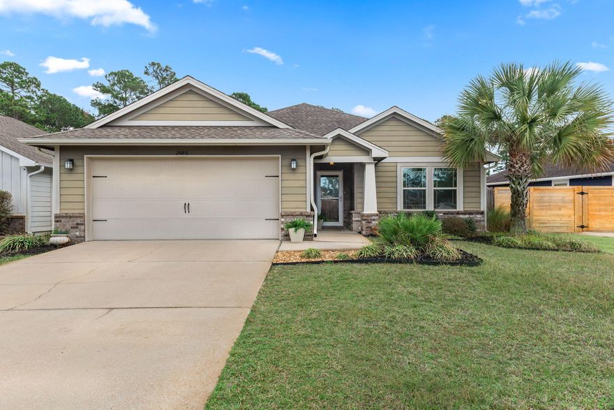 Lovely home now available in the Cottages at East River community of East Navarre. Just five minutes away from the beautiful white sands of Navarre Beach and twenty minutes to Hurlburt Field. Perfectly situated near the end of the street, the home is on a large lot over 200 feet deep with beautiful Florida landscaping and palm trees. There is a natural green space behind the home, which is the perfect setting to relax and enjoy the evening in the screened-in lanai. Inside features tall 10' ceilings, crown molding, trey ceilings and an open floorplan. The kitchen is immense, with beautiful granite countertops, a large breakfast bar, and an abundance of cabinets. The oversized master suite features a trey ceiling, walk-in closet, and tiled shower. This home has it all!