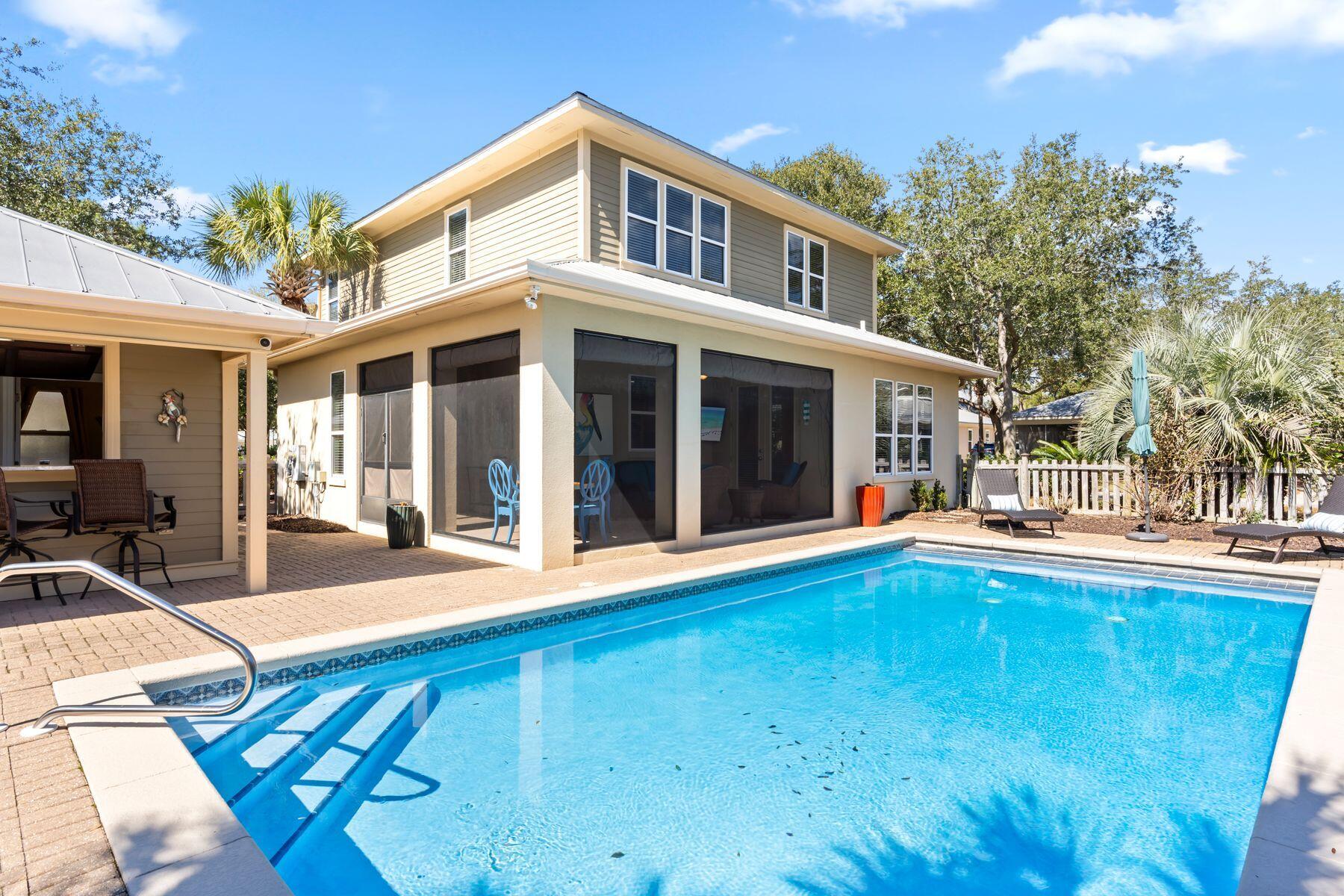 Situated in the heart of Sandestin Golf and Beach Resort, this four-bedroom, three-full and two-half-bathroom home offers one of the few private pools in the community and and exceptional living experience in the highly sought-after Crystal Lake community. With short-term rentals restricted, this peaceful neighborhood provides an ideal setting for a primary residence or 2nd home. Positioned on a beautifully landscaped corner lot, the home showcases an open concept floor plan, travertine and wood flooring, crown molding, recessed lighting and raised ceilings. Outdoor living is at its finest, with a 14 x 30 heated pool, brick paver decking, a pool house, and a sitting area for evening campfires. The pool house offers a half bath, changing area, extra storage, a refrigerator, an outdoor shower and a private poolside bar for serving summer cocktails. Beyond the property, Sandestin Golf and Beach Resort offers an array of world-class amenities, including four championship golf courses, 15 tennis courts, community pools, beach access, a spa and fitness center and the lively Village of Baytowne Wharf with boutique shopping, dining, nightlife and marina access. Designed for those seeking a refined coastal lifestyle, this Crystal Lake home delivers both elegance and comfort in an unbeatable location.