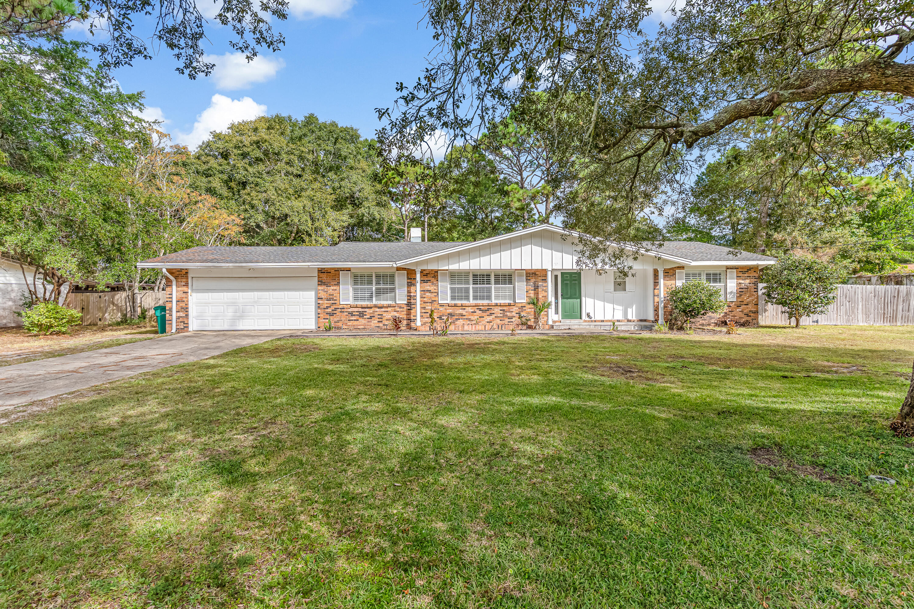 Charming and move-in ready, this home is perfectly located just minutes to Eglin AFB and only a short stroll to a county-maintained boat launch and picnic area on the bayou. With no HOA fees, you'll enjoy free neighborhood boat access and plenty of space for your vehicles, boats, or RV. Recent updates include fresh interior paint and a new front door, along with upgraded windows, patio doors, and an AC system. The kitchen features quartz counters, a wall oven, and cooktop range, complemented by plantation shutters throughout. Roof shingles were replaced in 2018, and a lawn pump with irrigation system keeps the yard easy to maintain. A wonderful blend of comfort, convenience, and coastal lifestyle awaits!