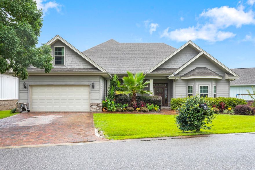 This custom-built home by Tidwell Builders in the gated community of Cypress Breeze Plantation has been a primary residence, never a rental, since it was constructed in 2013. It features nearly 3000 square feet of living space, with four bedrooms, a sunny Florida room, and a bonus room over the garage that could be a fifth bedroom. The teak entrance door opens to a broad entryway and full dining room with dark, rich engineered hardwood floors. An enormous living room and kitchen space is straight ahead with trayed ceiling. There are two bedrooms to the right. One is carpeted and has a walk-in closet and a connection to a full bath with tub/shower combo. The second bedroom, with bay windows, is just to the right of the front entrance. It was most recently used as an office. Off the kitchen is a tiled Florida room that affords access to the wooden deck and fenced backyard. There is a second backyard access door off the breakfast nook. The door to the master suite is between the kitchen and Florida room. The master bathroom has a granite double vanity, an elevated bathtub and large, separate tiled shower. The walk-in closet is off the master bath. From the full laundry (washer and dryer do convey with the sale), which is between the kitchen and garage, there is a carpeted staircase that splits in two halfway up. Turning left at the split leads to the bonus room over the garage, which has recently been used as a double twin bedroom. Turning right at the split leads to a second master suite upstairs, with a large double closet and en suite bathroom. The home also includes a two-car garage with shelving and enclosed storage, an expansive side yard with kids' playground, a fenced backyard with paver patio and wooden deck, and two HVAC systems: one of the systems is a Carrier five-stage, variable speed heat pump with excellent humidity control, and is extremely quiet and energy efficient. Rounding out the environmental features are spray foam insulation in the attic, and a whole-house water filtration and UV air treatment system.