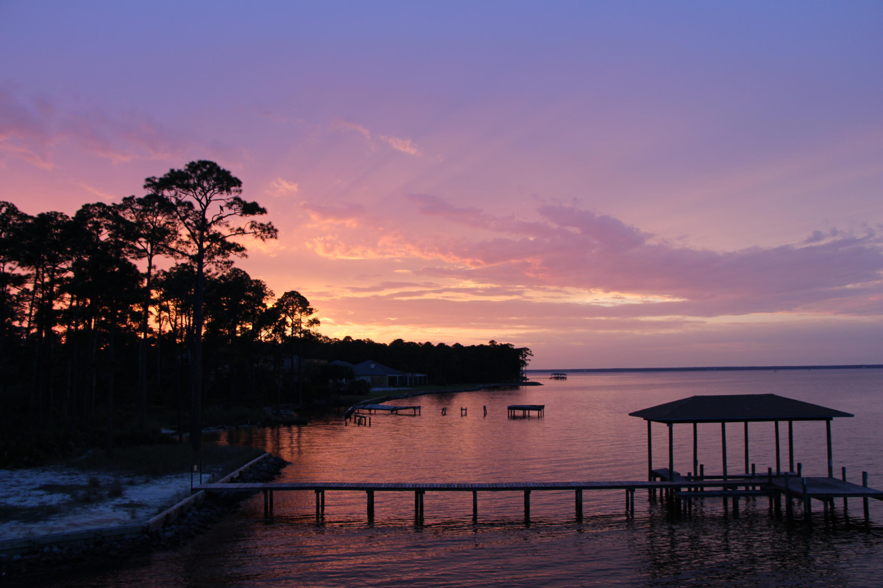 Under Contract-SELLER WILL ACCEPT BACK UP OFFERS --SELLER IS MOTIVATED ---Gorgeous Sunsets await you! Watch the dolphins & the eagles from this beautiful home - custom designed & built. It has too many smart features & amenities to name them all. Located on a .very lage Bay Front lot , navigable to the Gulf with 110 water front feet. Outside you'll find a beautiful pool & also a hot tub/spa; a trex dock with 2 jet ski lifts & a boat lift, as well as a fish cleaning station & observation deck - a sturdy seawall; an automatic irrigation well- & paver patio, deck, & driveway. Inside --spacious rooms with 10' & 12' ceilings & 9' doors-- hardwood, tile, & carpeting;