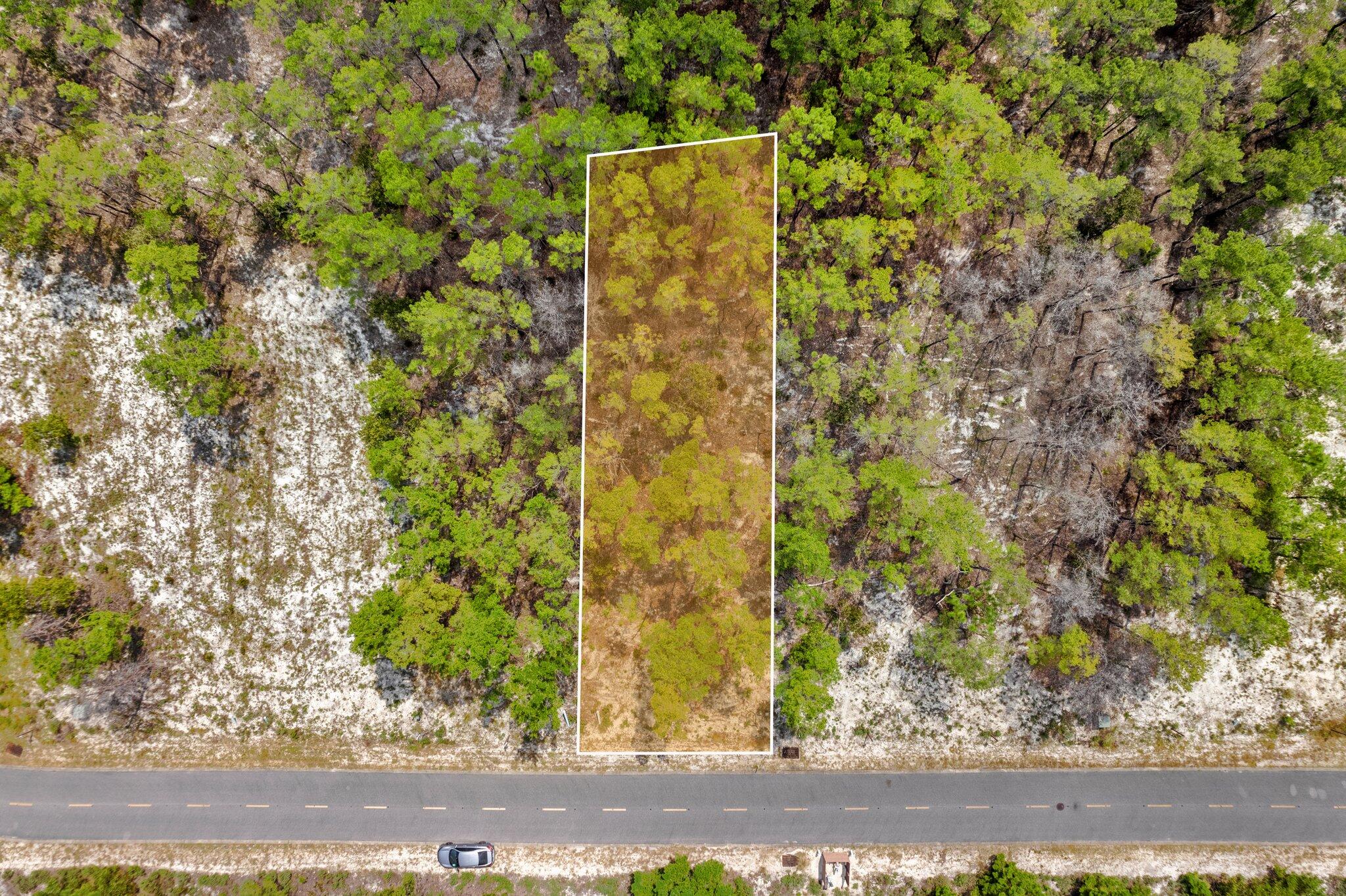 Do not miss out on this opportunity to own this beautiful lot situated on the 3rd fairway of Sharks Tooth Golf Course. Complete with Architectural plans for a 3B/3BA 1800+sqft home designed by J Michael Hunnicutt. Currently the lowest priced golf course lot in Wild Heron. Plans include a screened in porch with an outdoor kitchen. Enjoy the resort style amenities and all else Wild Heron has to offer, paddle board to Phillips Inlet, take your boat to the edge of Lake Powell where it meets the gulf, first class gym and equipment, a gated neighborhood with 24/7 security. What more could you ask for? 25 mins to the Airport (ECP), 12 mins to Pier Park, & 10 mins from 30A. Prime location to have the best of everything!