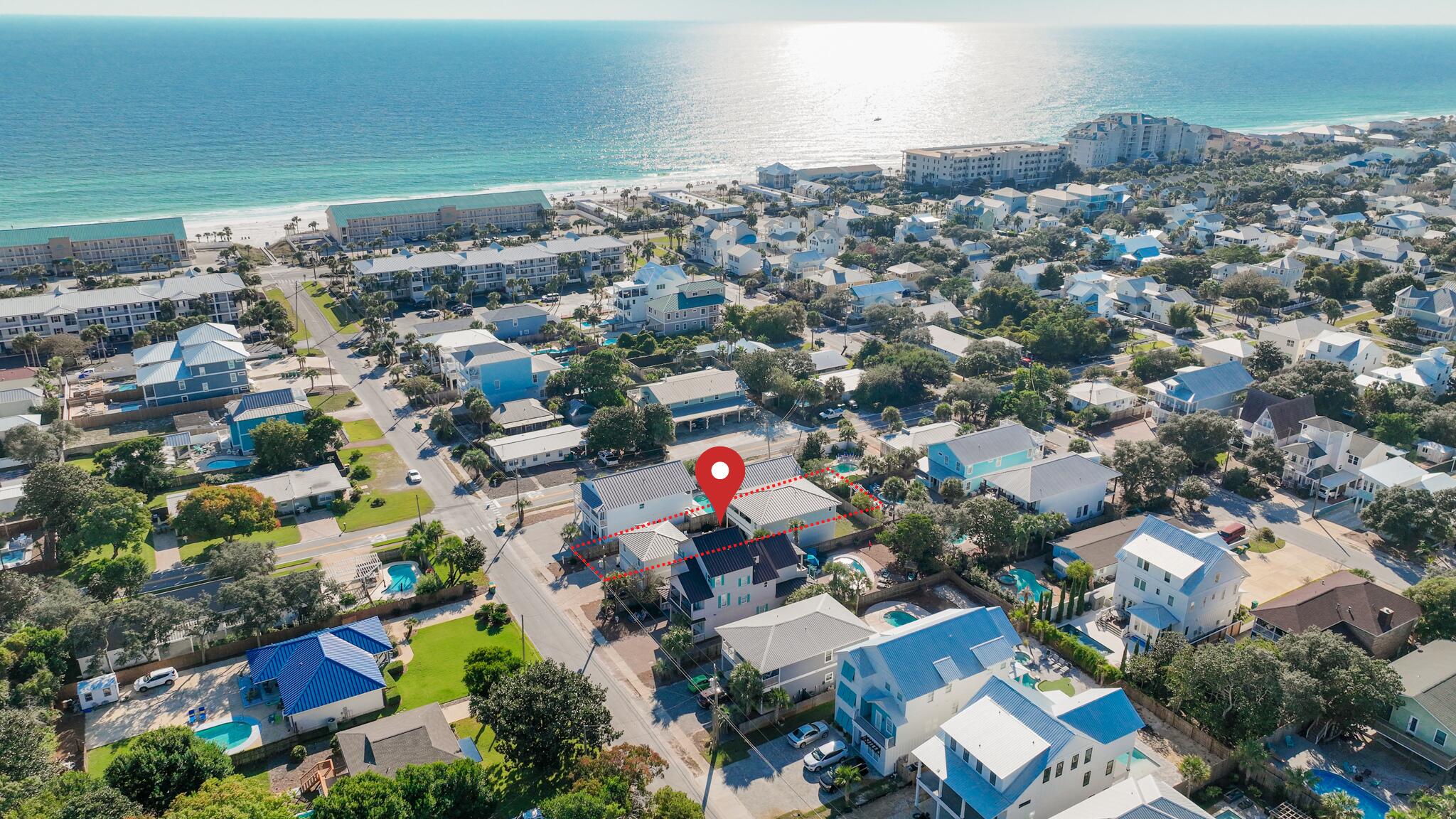 GROSS ANNUAL RENTAL INCOME OVER $200K!!!! This beachside investment has proven to be an income generator. You've hit the jackpot with this rare, highly sought-after, and amazingly valued opportunity that's simply too good to miss! With a fabulous location just over a block from access to the Gulf of Mexico in Destin, it's a lucrative short-term rental that has bookings already in place. This home is conveniently organized for small and large group vacation stays, offering flexible accommodations in two separate structures. Both interiors are open concept with fully equipped kitchens, and the main building features an inviting shaded balcony where guests can relax after a fun day in the surf and sand.