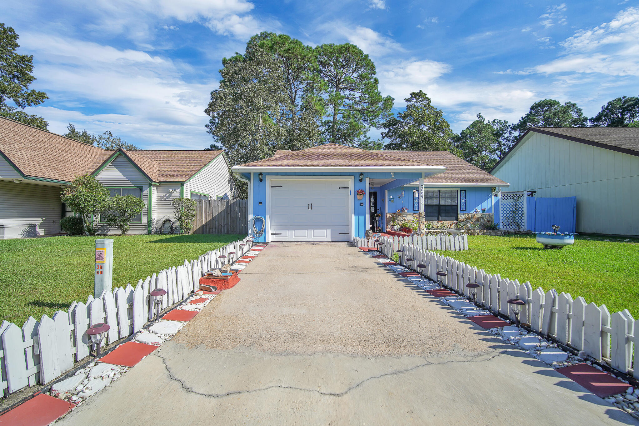 Seller could pay off solar panels with the right offer! Discover the epitome of Florida charm in the exclusive Hidden Trails community, where this beautifully maintained cottage offers an incredible opportunity for those seeking an exceptional value in a prime location. With an inviting open floorplan & family room, the cottage offers plenty of space for different ideas! The residence boasts tile flooring throughout for low-maintenance living. The kitchen has stainless steel appliances with a  breakfast/coffee nook or dining area. Step into the spacious family room, where sliding doors open onto a side-yard patio, ideal for relaxing. Roof is 2019 HVAC is 2007-Water Heater is 2011. A large screened porch off the kitchen provides a tranquil retreat, while the fenced back yard is perfect for gatherings & cookouts! Additional storage shed in the back. 