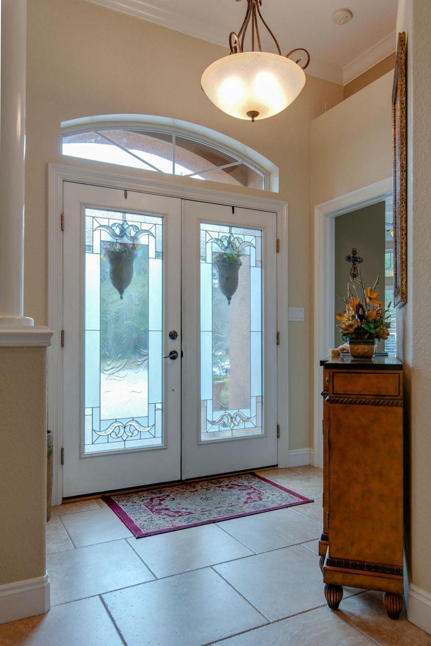 Back on Market NO FAULT TO SELLERS! Low yard maintenance. Deeded dock access to Sound! This beautiful custom built 3 bedroom/2 bathroom home sits on a cul-de-sac. Luxury living in waterfront community offers the finest in custom details. Paver driveway and double door entry will welcome you to with high 9-ft to 12-ft ceilings, freshly painted walls, heavy crown molding, and tile and hardwood flooring throughout the living area. Both the dining room and the family room feature high boxed trey ceilings. The kitchen is cooks dream with hop up breakfast bar, breakfast room, extensive granite counter tops, under cabinet lighting, tall custom cabinets and glass fronted cabinets with crown. Stainless appliances include wine bar, commercial grade refrigerator, oven, microwave, dishwasher. MUST SEE