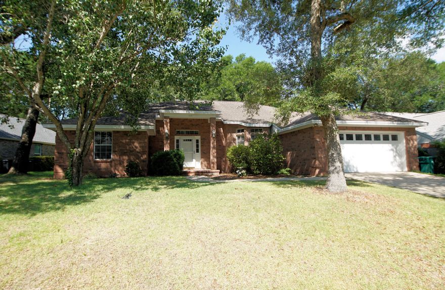 HUGE PRICE ADJUSTMENT!! Welcome to Parkwood Estates, a gated community in Bluewater Bay!  Entering this home through its lovely tiled foyer, you will see the large family room with wood laminate flooring and a cozy fireplace. Adjacent to the family room is the large kitchen and breakfast nook. On the other side of the kitchen is the dining room (currently used as a play room). The oversized master suite is on one side of the home and there are two additional bedrooms and another full bath on the other. The laundry room is oversized and has room for a second refrigerator. There is a large screened porch on the back of the house and the natural back yard has plenty of room for a future pool. Noteworthy features include 2022 roof, 2020 HVAC, 2019 water heater, Termite bond with Bryan Pest