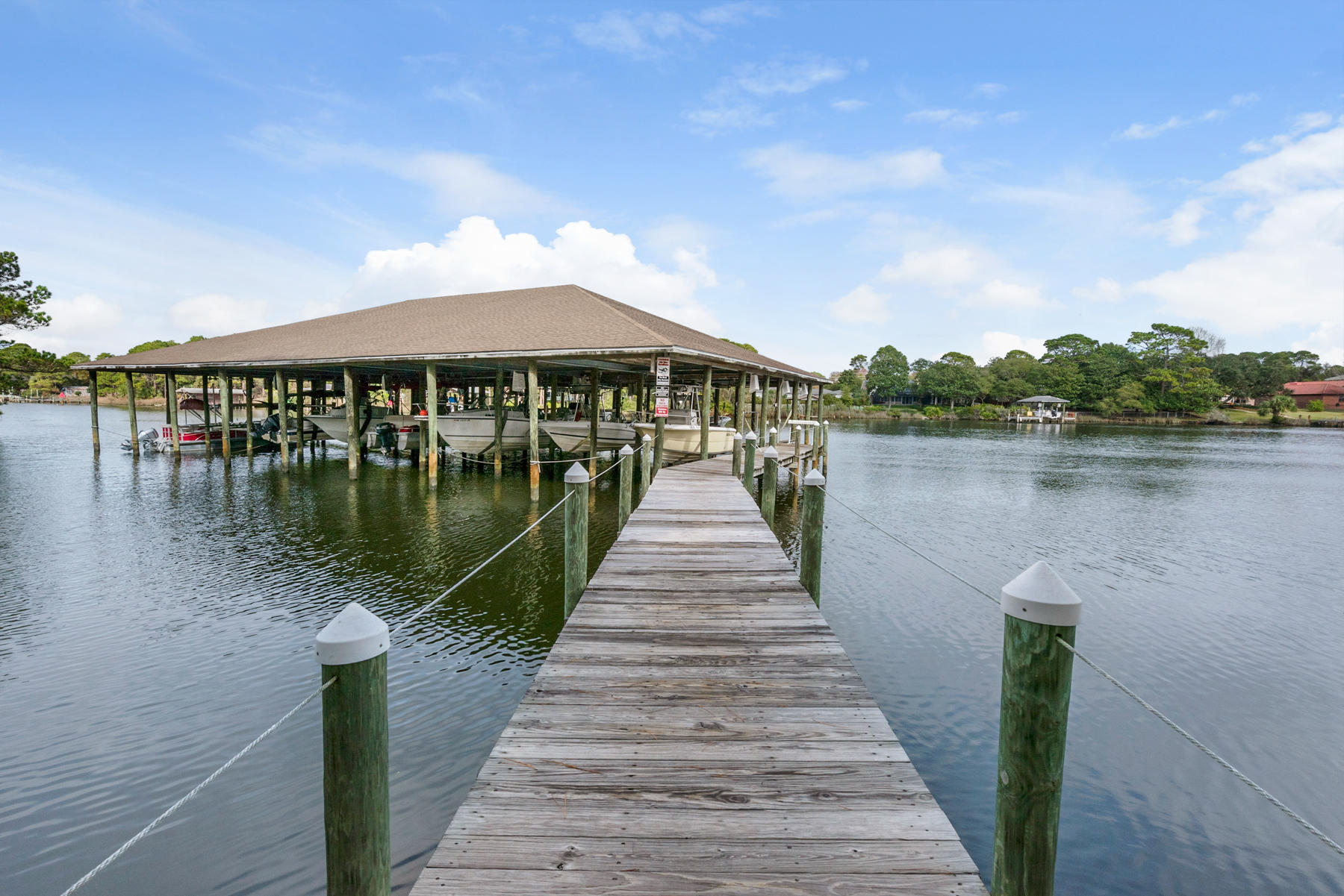 Live the dream life! Boating, swimming, beach, anything you can think of right outside your door. This 2br/2ba condo is located on the lagoon that has gulf access in a complex offering boat slip rentals, a pool and a clubhouse. Just a short walk to the beach so you get the best of everything. This is perfect rental or second home to enjoy life in paradise. Home is furnished so all you have to do is turn the key! Beach access just walking distance with parking. Measurements are approximate must verify if important.