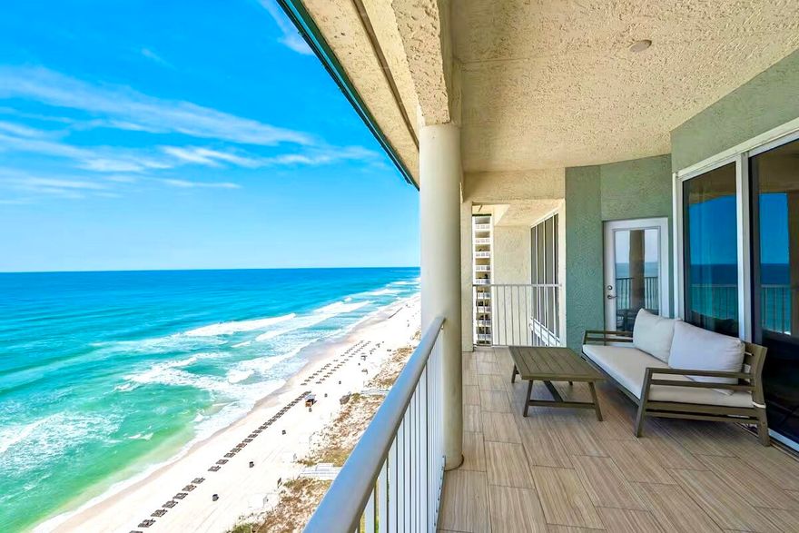 The ''Crown Jewel''! Once-in-a-lifetime opportunity to own the best condo in the most highly sought-after resort along the Gulf! The Penthouse-end unit, with spectacular views both East & West, where every room fronts the beautiful Emerald-Green Gulf! 1400 feet of private white sugar-sand beach & 3 heated pools, including a huge 7500 sq ft  lagoon pool with waterfalls & tropical palm-laden island & Tiki bar. Great investment opportunity-booked solid year after year, plus many family vacations. Owner financing too, at low rates! This spacious 3 BR, 3 bath condo has been meticulously renovated & remodeled by the professional designer-owner, making it one of the most attractive units in the resort. Every room offers breathtaking floor-to-ceiling Gulf-front views, with private balcony access. Upgrades include new Quartz Countertops, custom tile backsplash, new LVP flooring, new lighting, new plumbing fixtures, stainless steel appliances, built-in bookcases, and a Master Ensuite featuring both a tub and separate shower, double vanities and linen closet. Vaulted ceilings are also unique to this luxurious Penthouse. One of the Bedrooms is a separate secondary Master suite, with wet bar, private bath, a 2nd laundry room and a private Gulf-front balcony. Long Beach Resort unit 1406 is a corner unit in the highly sought after ''six stack'' which is the only Western Sunset facing corner Penthouse and offers extra privacy, extra balcony space, and an incredible view of the sunset due to its unobstructed western view corridors. Long Beach Resort also has the longest private beach, with low condo density due to every condo being designed parallel to the beach, instead of the typical shotgun floorplan; and only being a 14-floor height instead of other typical 30-floor high-density condos. Amenities galore with numerous Polynesian pools, 3 whirlpools, bar/grill poolside, self-serve grills, fitness center, beach vendor services such as chairs, jet-ski and parasail, and a gated security-entry with an abundance of main-level parking. Long Beach Resort is one of the most popular resorts in Panama City Beach, with a central location close to great restaurants and shopping. Long Beach is always in high demand due to its stellar rental returns and close proximity to sporting complexes, conference centers, shopping, dining, and entertainment options as well as being a short drive from a major regional airport
Unlike other resorts, Long Beach offers a large open-air parking lot that allows guests to park to in front of their tower, and to load & unload under cover at the door. Long Beach Resort is a true piece of Panama City Beach history! 
Long Beach Resort will soon be upgraded with new renovated stucco exteriors, balcony railings, etc during the winter months ahead. Therefore, the owner will pay half of the HOA fees for the next two years, when the HOA fees are expected to be reduced accordingly.  
A great opportunity to own this unique condo, at this low price, with low interest owner financing. 