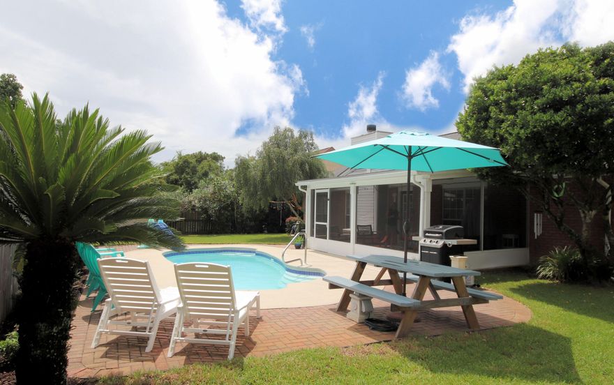 Enjoy the Florida sunshine by your saltwater pool, just minutes from Hurlburt Field. After the pool, relax in your move-in ready, updated, vaulted ceiling 3 bedrooms/2 bathrooms 1775 sq ft home with brand new wall-to-wall wood look tile floors. Have a boat or RV? Plenty of parking in the large yard with gated access to the backyard. Sleep easy knowing you're storm ready with low insurance rates, wind mitigation, storm shutters, newer roof with SWR, and a whole home generator. The living room has a wood burning  fireplace, and new tiled surround and custom mantle. The kitchen has granite countertops, stainless built in microwave, oven/cooktop, and refrigerator. The kitchen also has raised ceilings and an eat-in dining area with large picturesque windows. The home boasts a separate dining